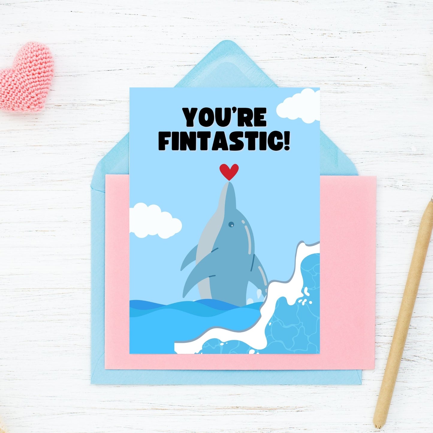 Printable Valentine’s Day Greeting Card featuring the phrase “You’re Fintastic” with a dolphin theme. Designed as a 5x7 PDF on an 8.5 x 11 sheet with two cards per page. A cute and punny Valentine’s card for dolphin and ocean lovers.