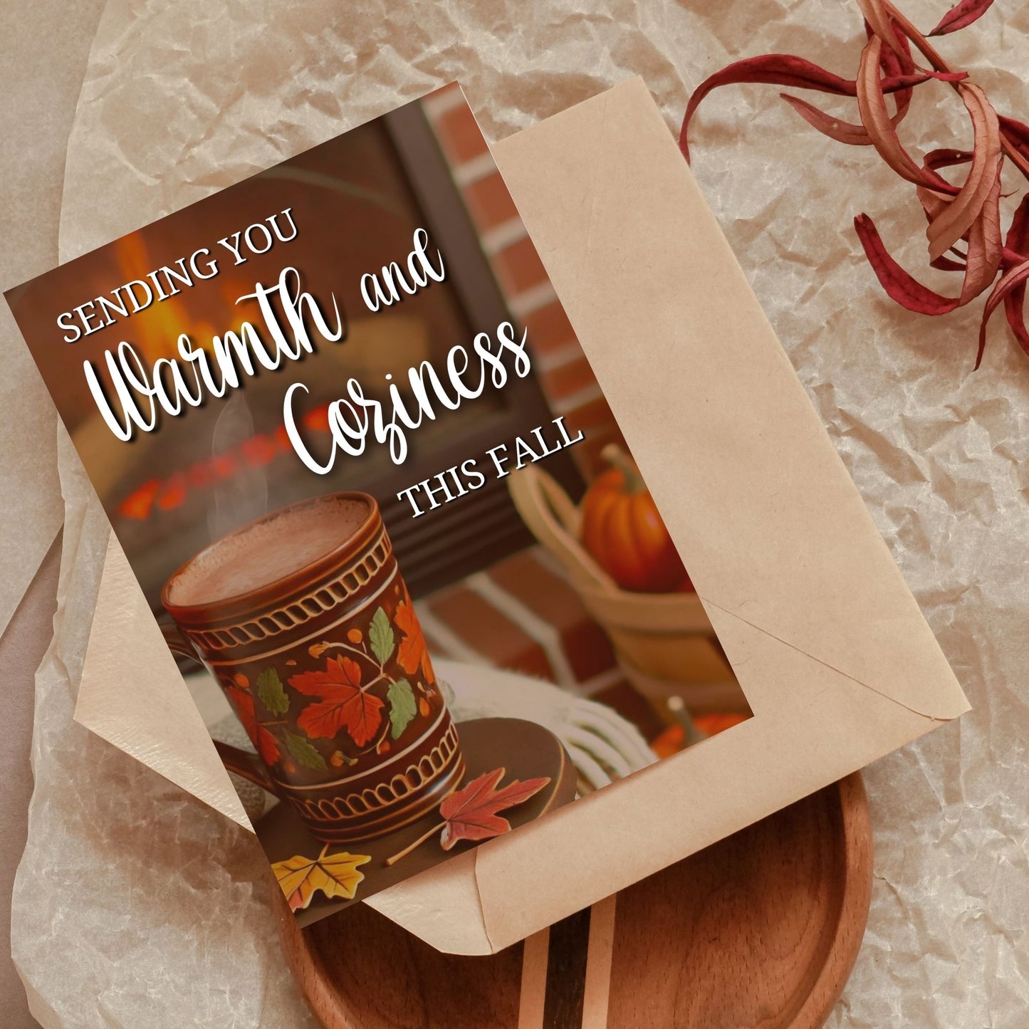 Printable Fall Greeting Card with a cozy scene featuring a steaming mug and fireplace, and the message 'Sending You Warmth and Coziness This Fall,' ideal for autumn greetings.