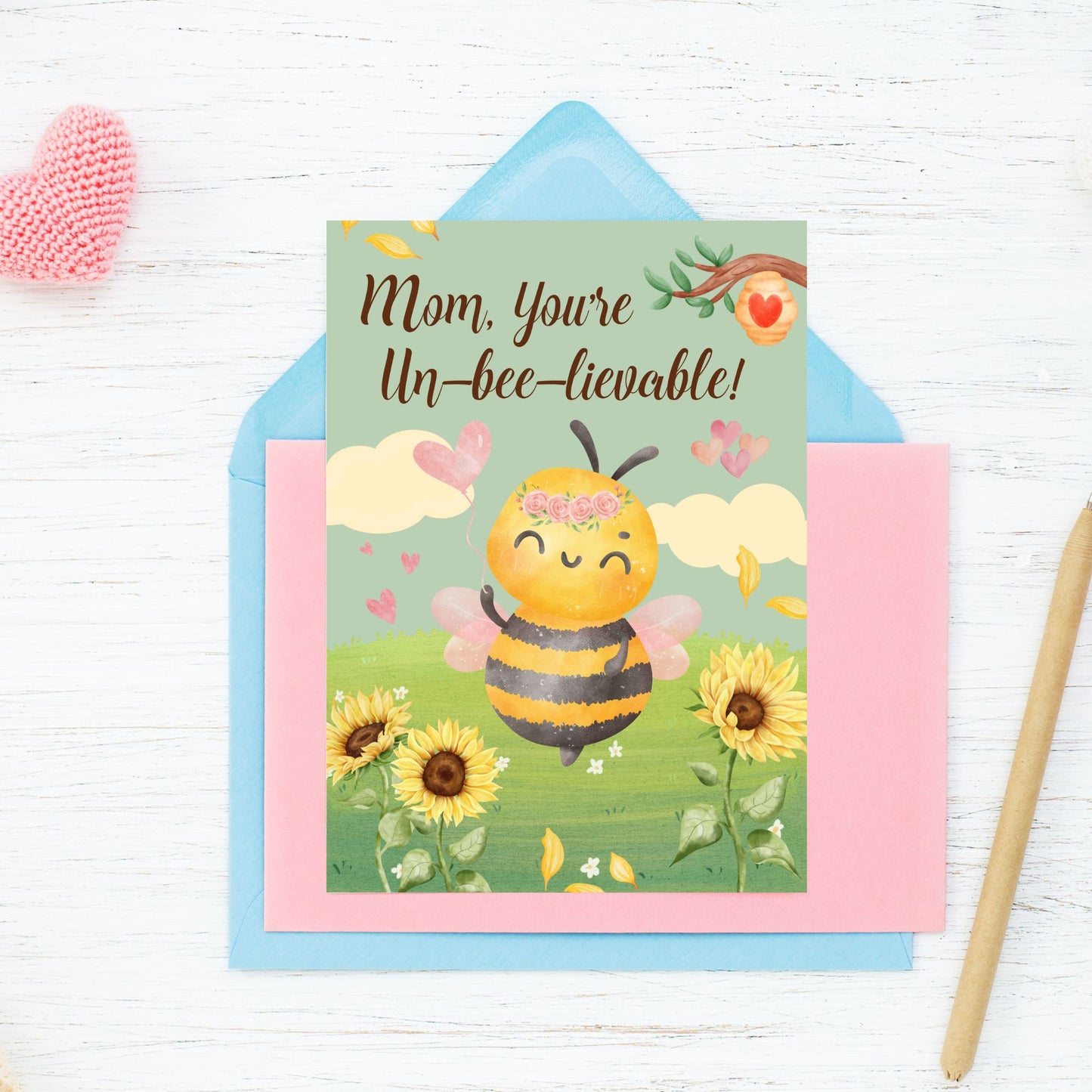 Printable 5x7 Mother’s Day card with a bee illustration and the message “Mom, You’re Unbeelievable,” featuring bright yellow and pastel colors, available as an instant download PDF.