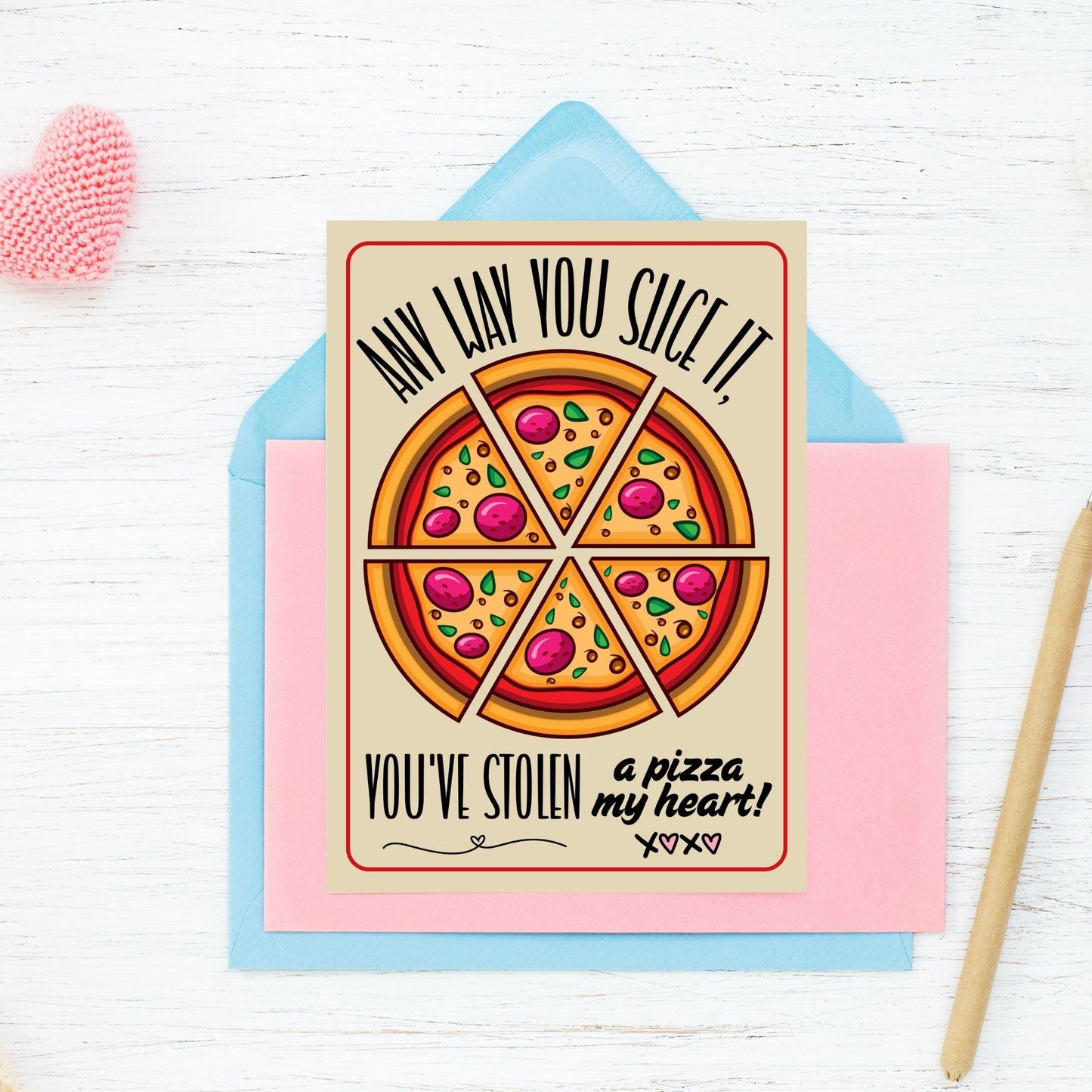 Printable Valentine’s Day Greeting Card with the pun “Any Way You Slice It, You’ve Stolen a Pizza My Heart.” Designed as a 5x7 PDF on an 8.5 x 11 sheet with two cards per page. A perfect punny Valentine’s card for pizza lovers!
