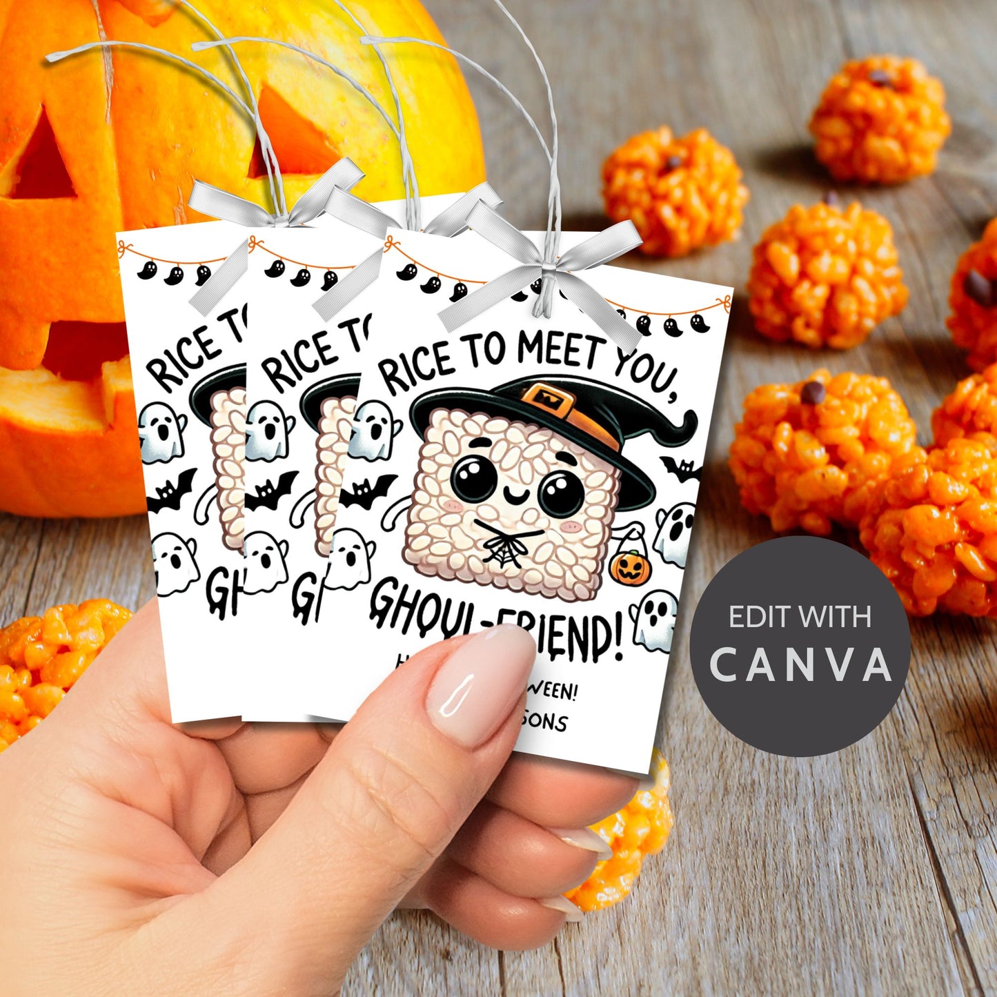 Cute Halloween-themed gift tags featuring a witchy rice krispie treat character, surrounded by ghosts, bats, and pumpkins. The tags say "Rice to Meet You, Ghoul-Friend!" and are 2.5 x 3.5 inches, laid out 8 per sheet on an 8.5 x 11-inch page. Includes a printable PDF and a link to an editable Canva template.