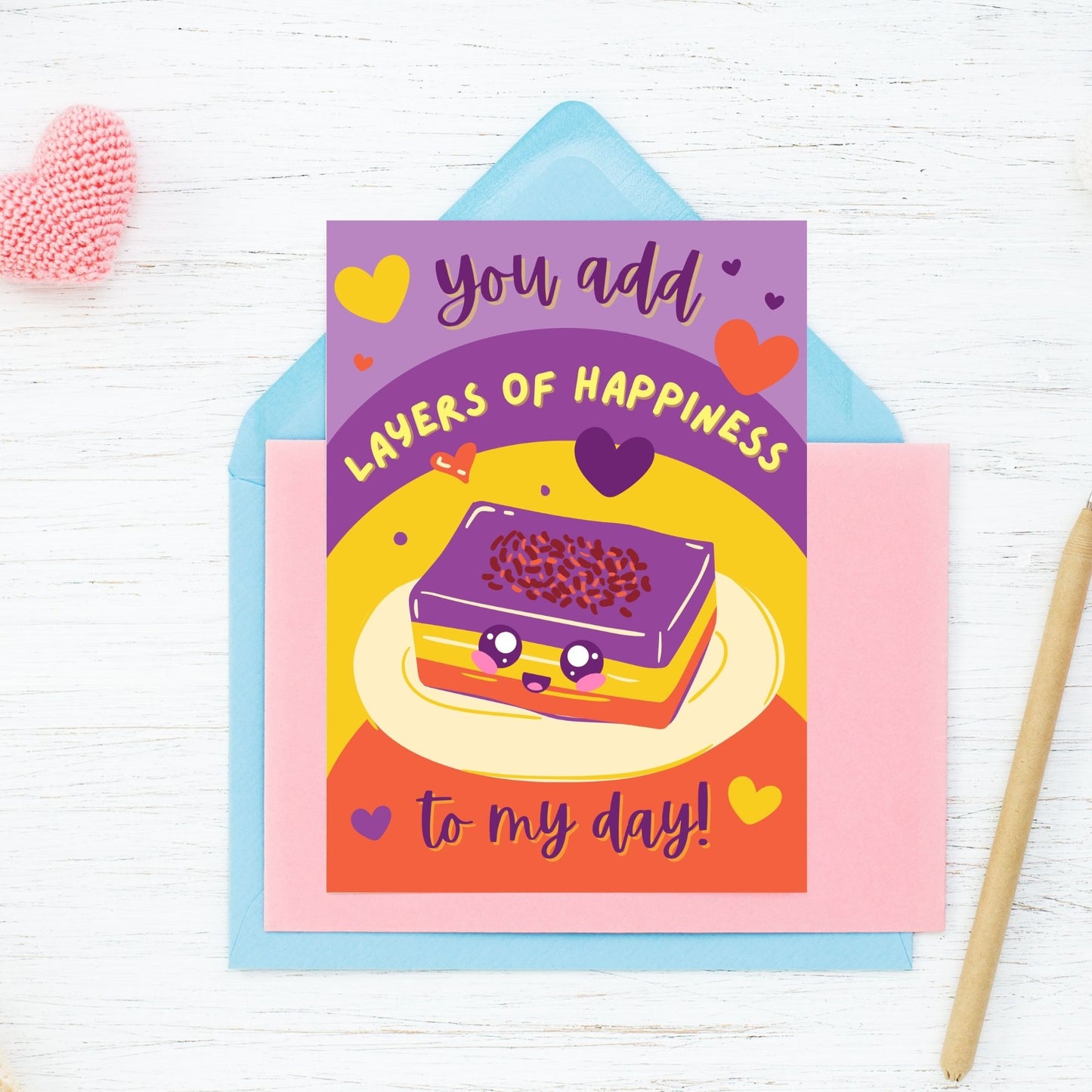 Printable Valentineās Day card featuring the phrase āYou Add Layers of Happiness to My Dayā with a Filipino Sapin-Sapin-inspired design. Designed as a 5x7 PDF on an 8.5 x 11 sheet with two cards per page. A punny and heartfelt Valentineās card for Filipino food lovers.