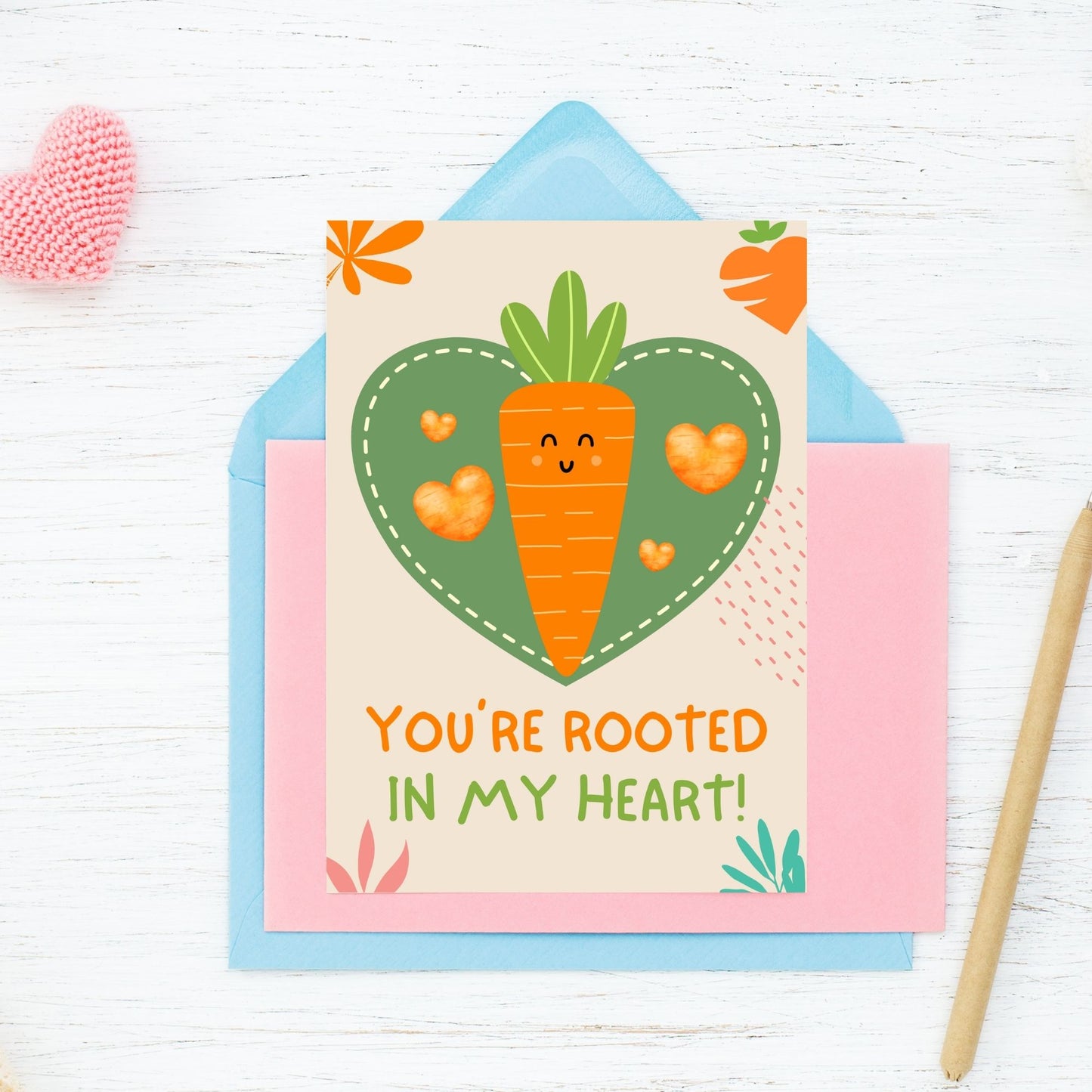 Printable Valentine’s Day Greeting Card featuring the phrase “You’re Rooted in My Heart” with a carrot theme. Designed as a 5x7 PDF on an 8.5 x 11 sheet with two cards per page. A sweet and punny Valentine’s card for veggie lovers and friends.