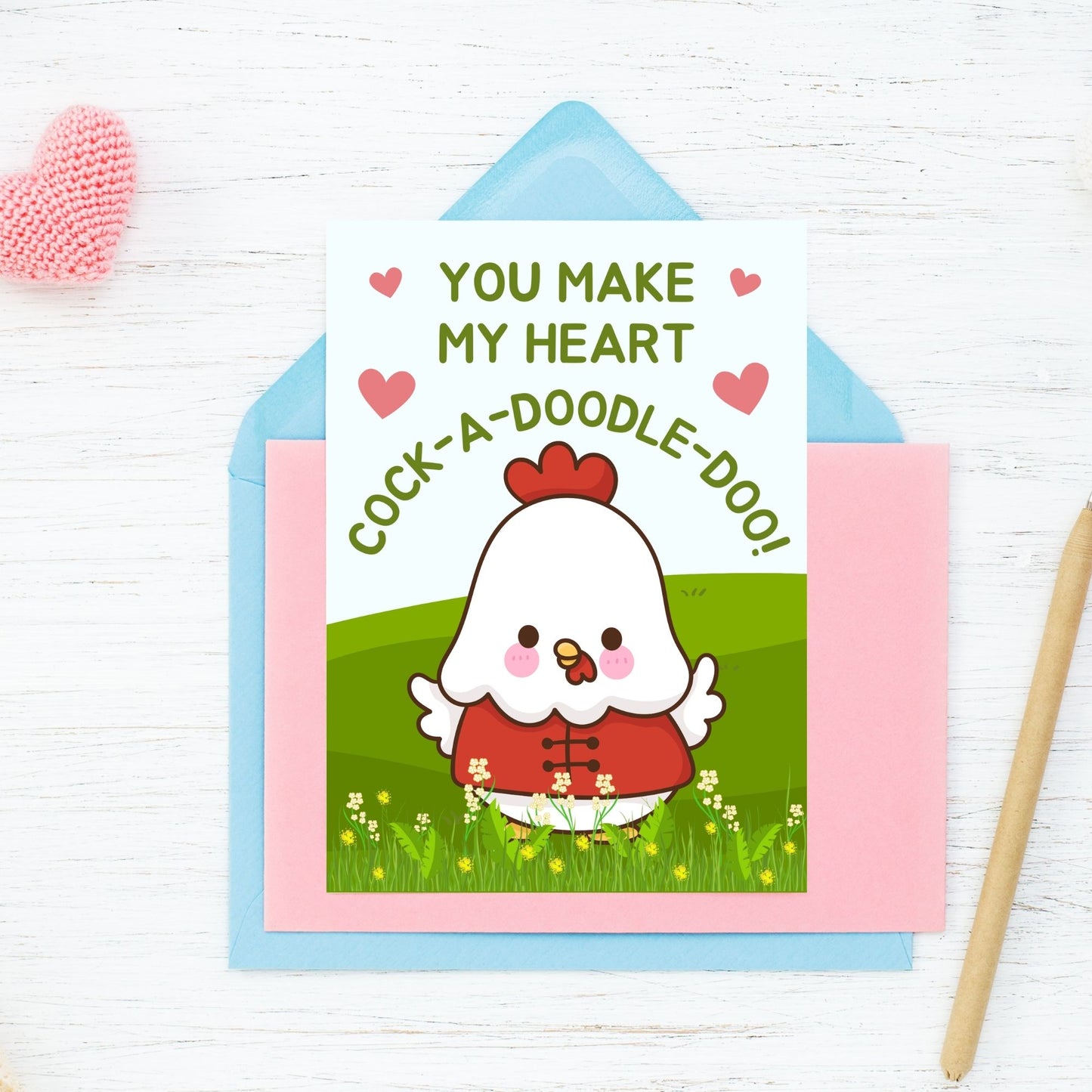 Printable Valentine’s Day Greeting Card featuring the phrase “You Make My Heart Cock-a-doodle-doo” with a rooster theme. Designed as a 5x7 PDF on an 8.5 x 11 sheet with two cards per page. A funny and punny Valentine’s card for loved ones.