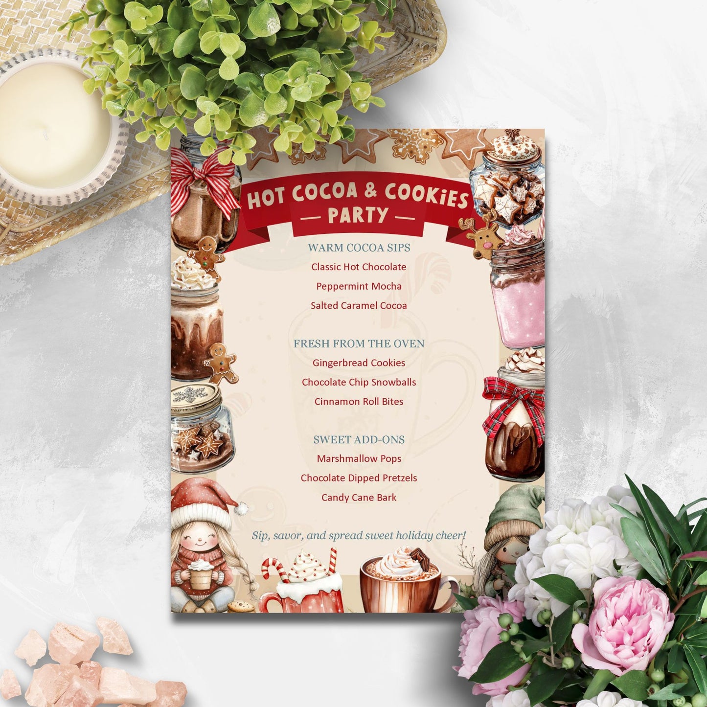Hot cocoa and cookies party invitation with festive design on a white surface with flowers and hot cocoa.