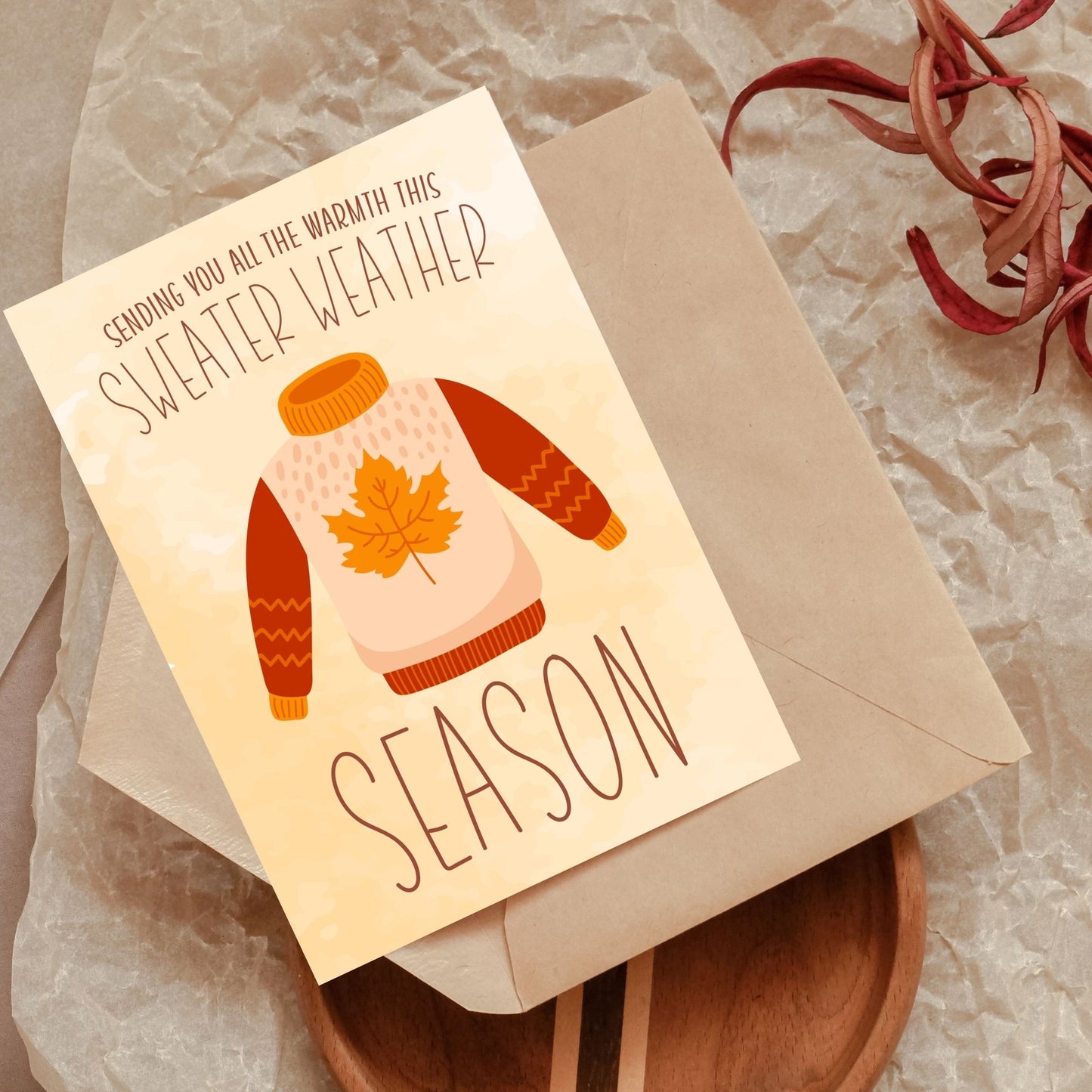 Printable Fall Greeting Card featuring a cozy sweater design with the message 'Sending You All the Warmth This Sweater Weather Season,' set on a warm autumn background.