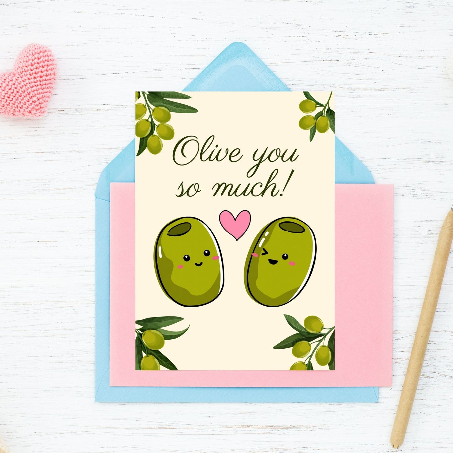 Printable Valentine’s Day Greeting Card featuring the pun “Olive You So Much.” Designed as a 5x7 PDF on an 8.5 x 11 sheet with two cards per page. A sweet and punny Valentine’s card for foodies and friends.