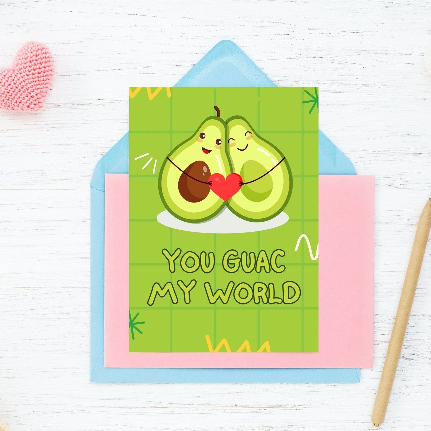 Printable Valentine’s Day Greeting Card featuring the phrase “You Guac My World” with an avocado theme. Designed as a 5x7 PDF on an 8.5 x 11 sheet with two cards per page. A fun and punny Valentine’s card for avocado and guacamole lovers.