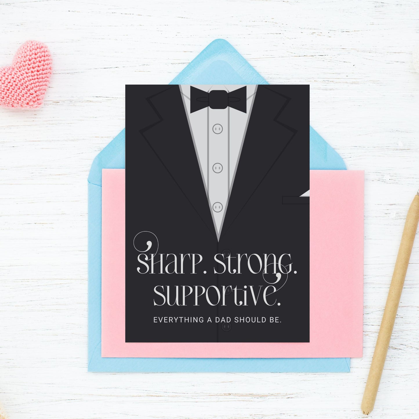 Father's Day card printable with bold text 'Sharp. Strong. Supportive.' featuring a minimalist design of a suit and tie in grayscale tones.