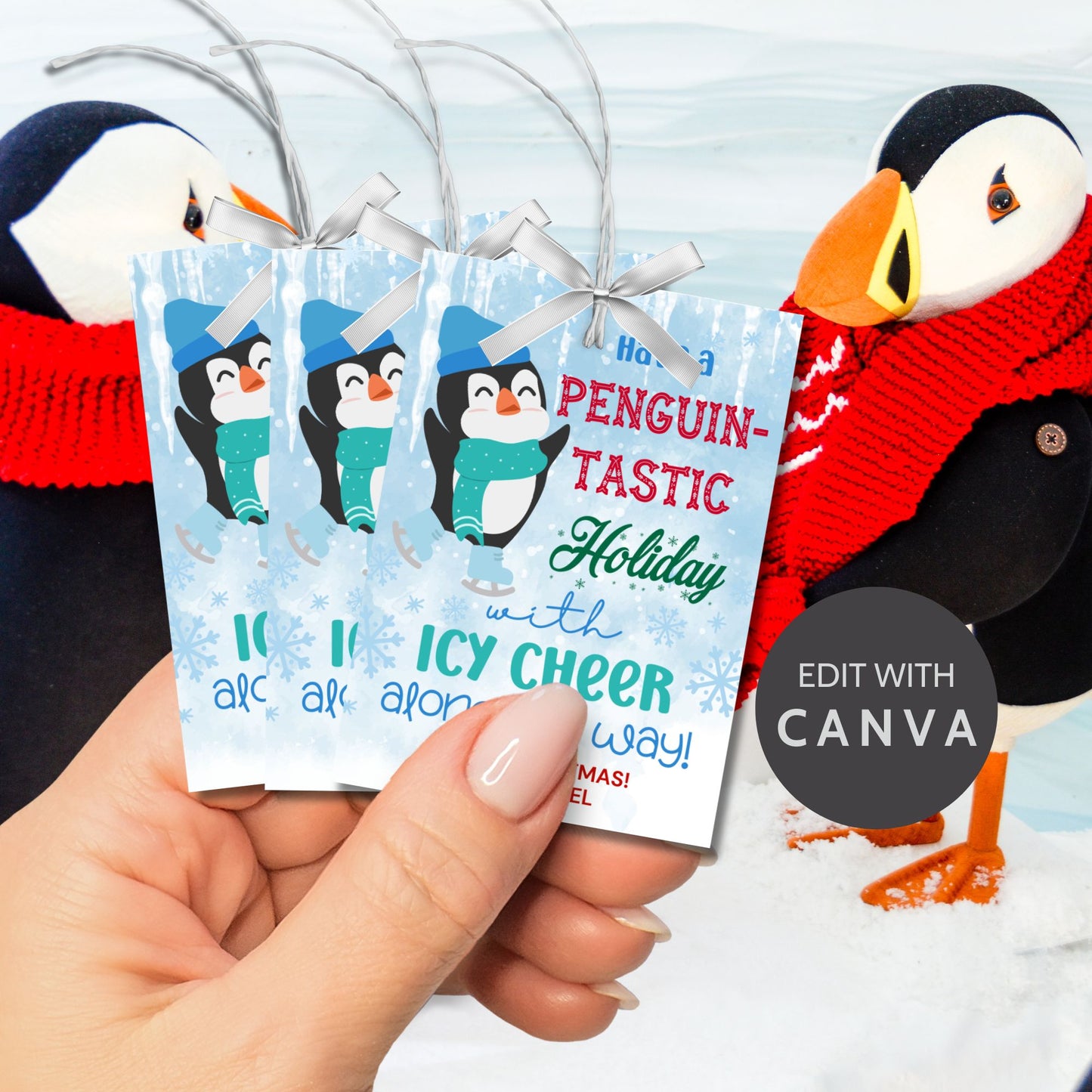 Penguin-themed Christmas gift tags featuring a happy penguin wearing a blue hat and green scarf, surrounded by snowflakes. The text reads 'Have a Penguin-tastic Holiday with Icy Cheer Along the Way!'