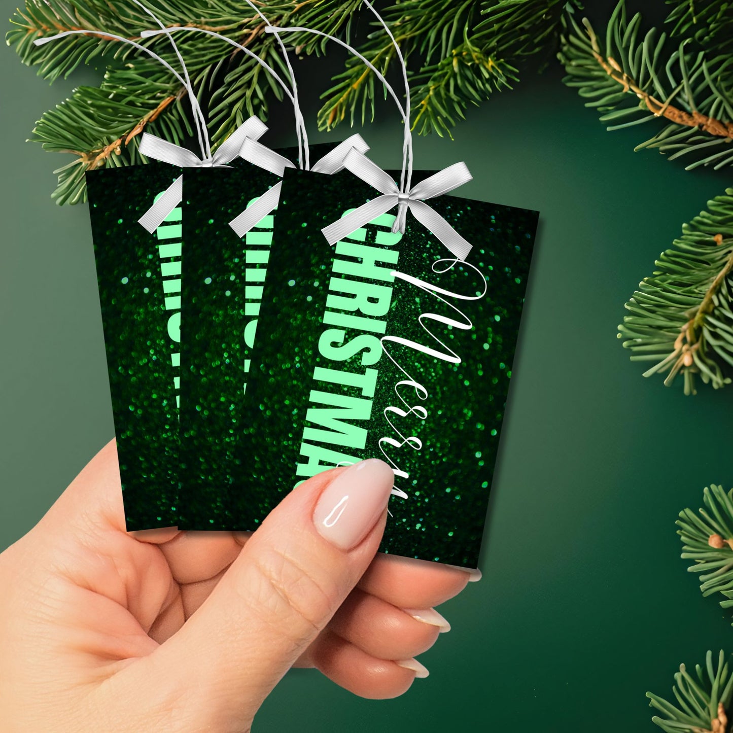 Green-themed ready-to-print Christmas gift tags featuring a glittery green background with elegant "Merry Christmas" text, 2.5 x 3.5 inches, 8 per 8.5 x 11-inch sheet.