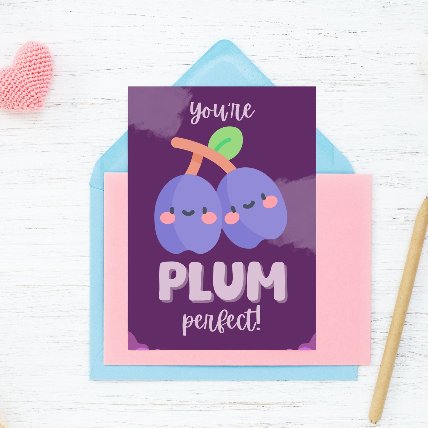 Printable Valentine’s Day Greeting Card featuring the phrase “You’re Plum Perfect” with a plum design. Designed as a 5x7 PDF on an 8.5 x 11 sheet with two cards per page. A sweet and punny Valentine’s card for loved ones.