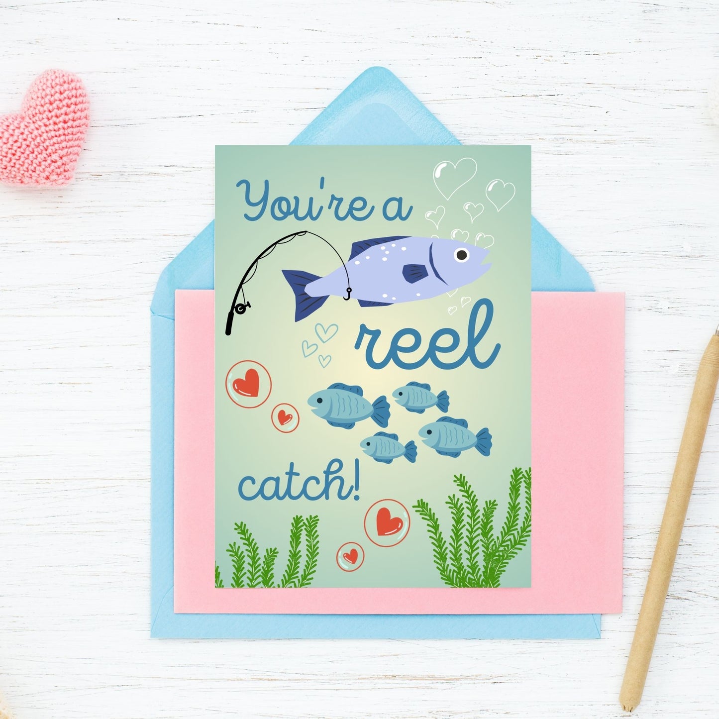 Printable Valentine’s Day Greeting Card with the pun “You're a Reel Catch.” Designed as a 5x7 PDF on an 8.5 x 11 sheet with two cards per page. A fun and punny Valentine’s card for fishing lovers!