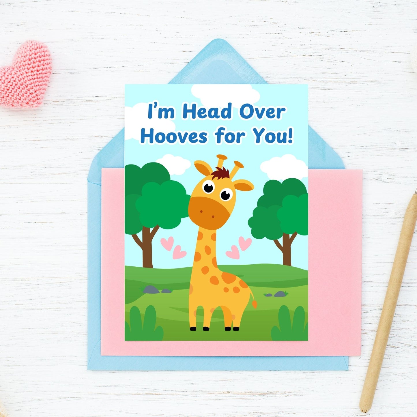 Printable Valentine’s Day Greeting Card featuring the phrase “I’m Head Over Hooves for You” with a giraffe theme. Designed as a 5x7 PDF on an 8.5 x 11 sheet with two cards per page. A sweet and punny Valentine’s card for giraffe lovers and friends.