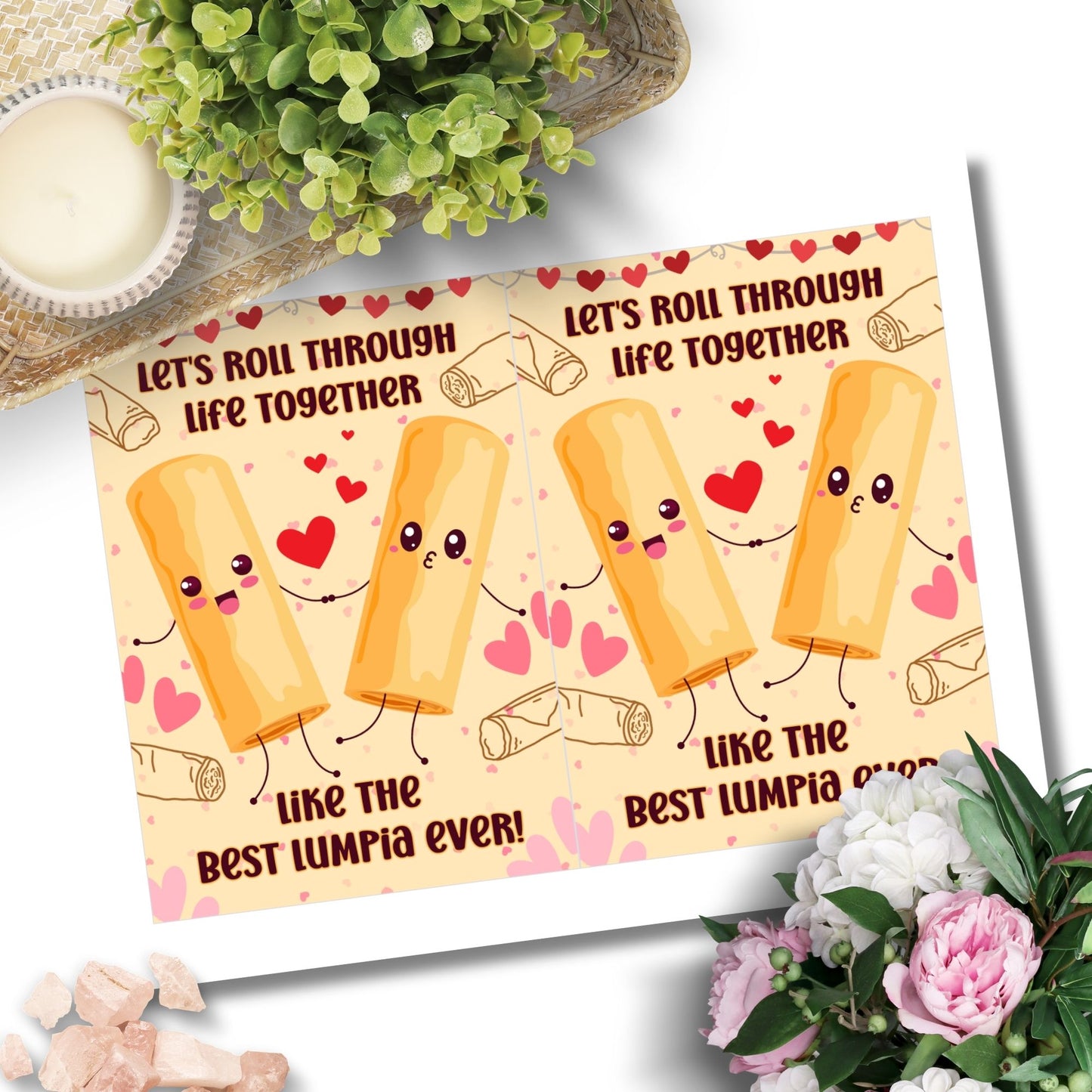 Printable Valentineās Day card featuring the phrase āLetās Roll Through Life Together Like the Best Lumpia Everā with a Filipino Lumpia-inspired design. Designed as a 5x7 PDF on an 8.5 x 11 sheet with two cards per page. A punny and heartfelt Valentineās card for Filipino food lovers.