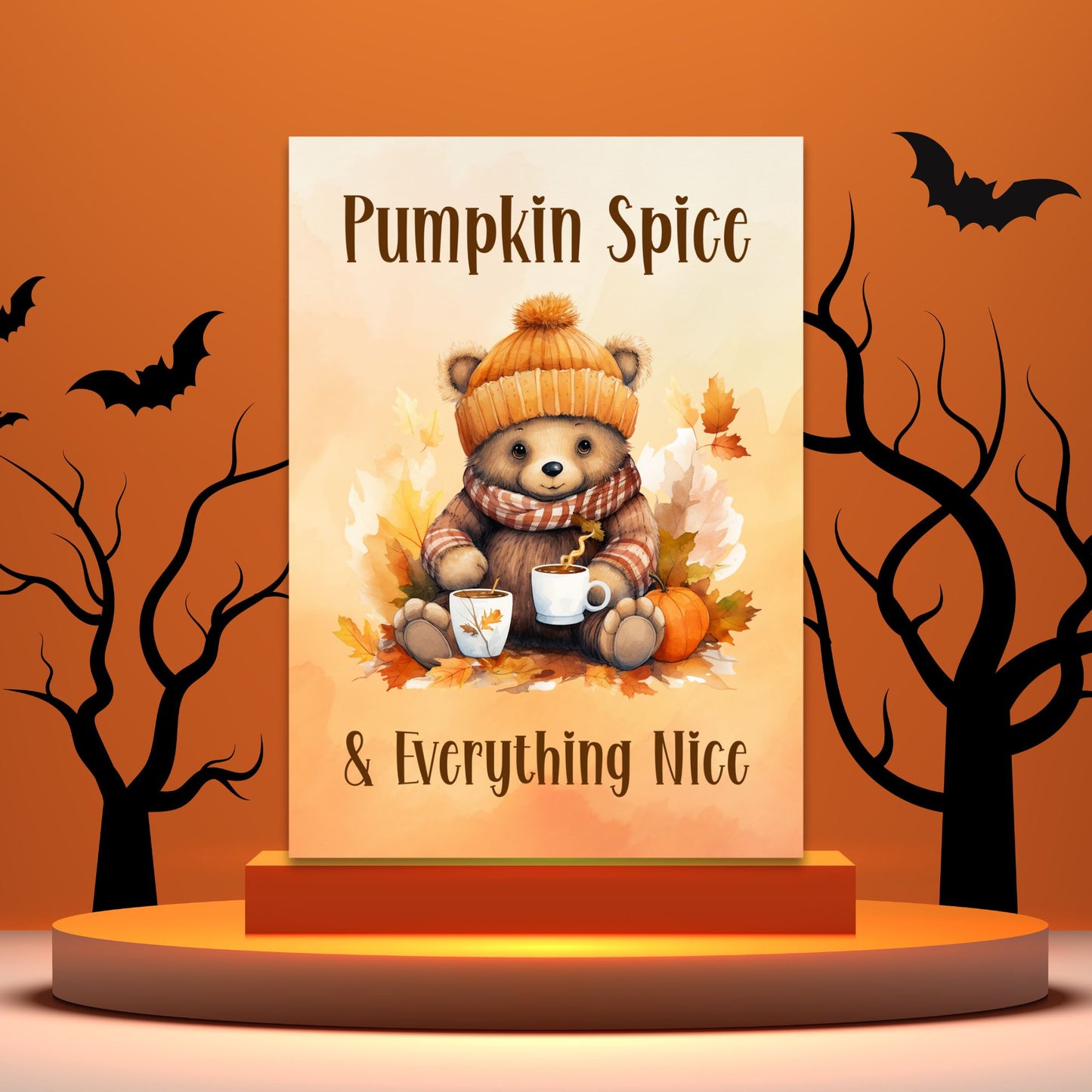 Decorative sign with a bear holding pumpkin spice-themed items against an orange background with bats and trees.