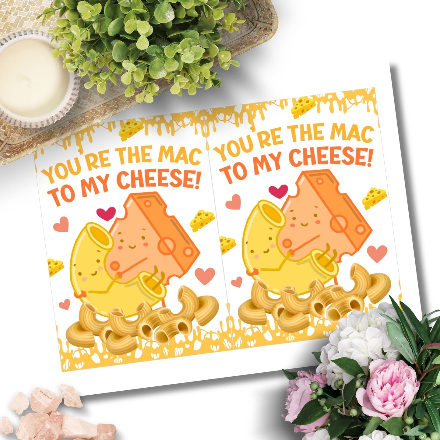 Printable Valentine’s Day Greeting Card featuring the phrase “You’re the Mac to My Cheese” with a mac and cheese theme. Designed as a 5x7 PDF on an 8.5 x 11 sheet with two cards per page. A fun and heartfelt Valentine’s card for loved ones.