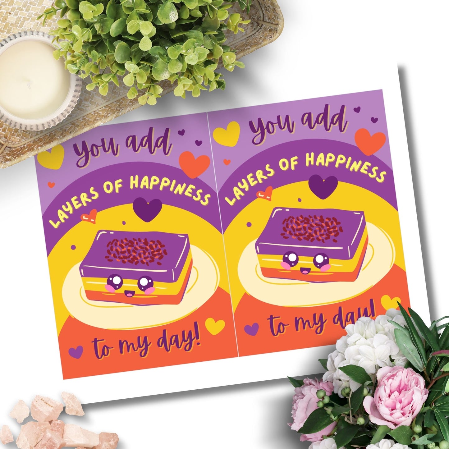 Printable Valentineās Day card featuring the phrase āYou Add Layers of Happiness to My Dayā with a Filipino Sapin-Sapin-inspired design. Designed as a 5x7 PDF on an 8.5 x 11 sheet with two cards per page. A punny and heartfelt Valentineās card for Filipino food lovers.