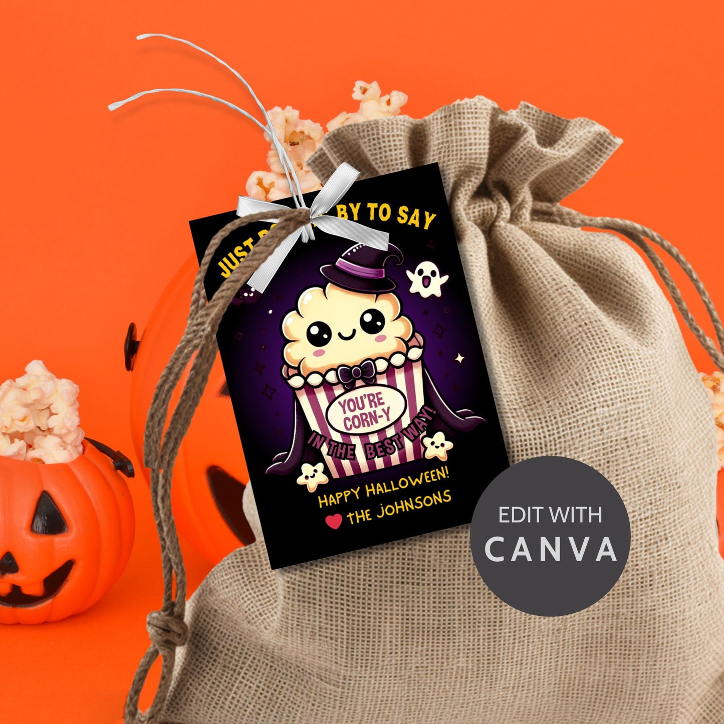 Halloween-themed printable gift tags with the message "Just Poppin' By to Say You're Corn-y in the Best Way" featuring a cute popcorn character dressed in Halloween attire. Tags are 2.5 x 3.5 inches, laid out 8 per sheet on a standard 8.5 x 11-inch page. Includes a printable PDF and a PDF with a link to an editable Canva template.