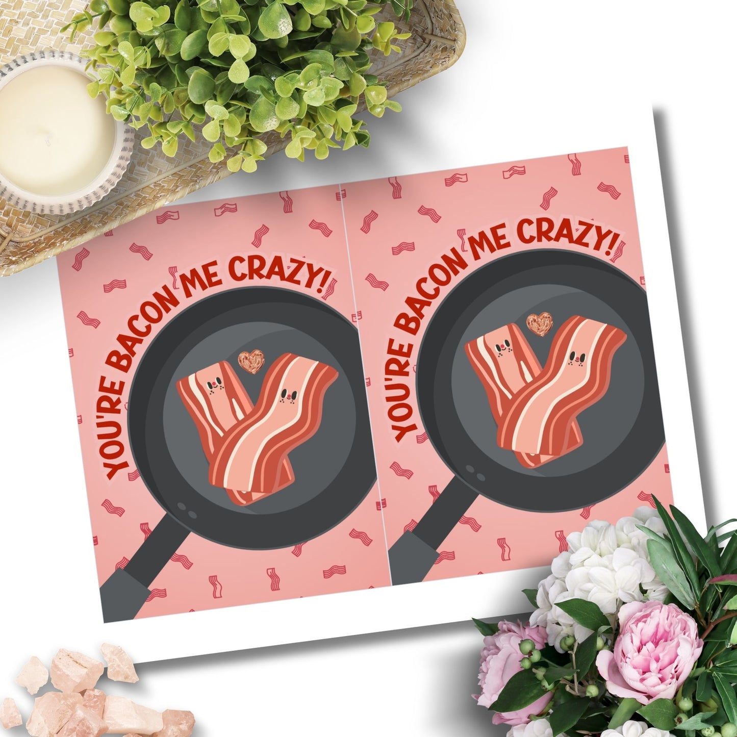 Printable Valentine’s Day Greeting Card featuring the phrase “You’re Bacon Me Crazy” with a bacon theme. Designed as a 5x7 PDF on an 8.5 x 11 sheet with two cards per page. A fun and punny Valentine’s card for bacon lovers and friends.