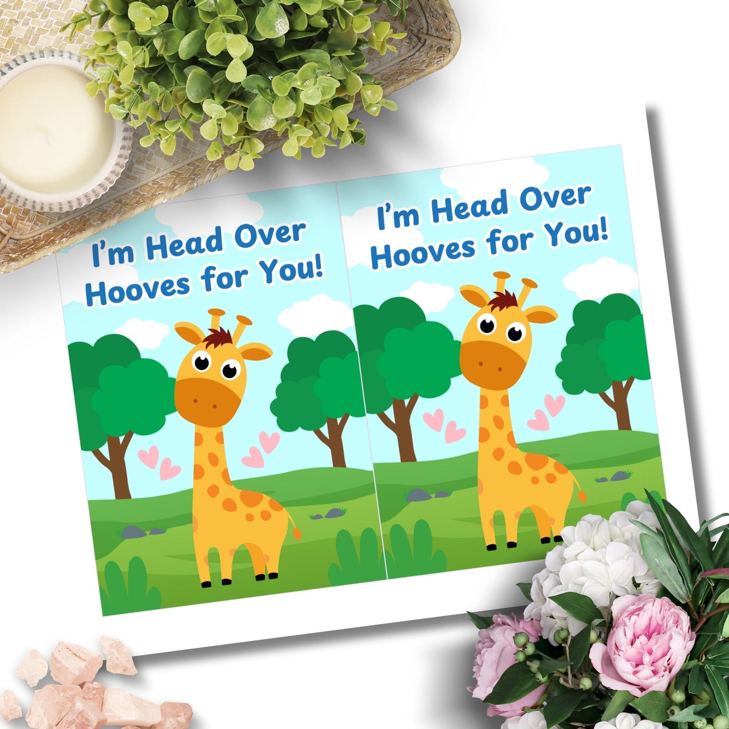 Printable Valentine’s Day Greeting Card featuring the phrase “I’m Head Over Hooves for You” with a giraffe theme. Designed as a 5x7 PDF on an 8.5 x 11 sheet with two cards per page. A sweet and punny Valentine’s card for giraffe lovers and friends.