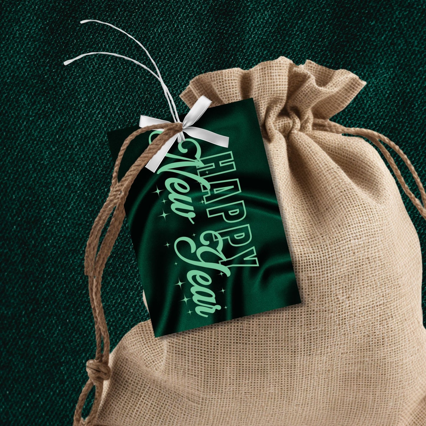 Elegant emerald green Happy New Year printable gift tags with a satin-inspired background and shimmering accents, ideal for luxury gifting and party favors.