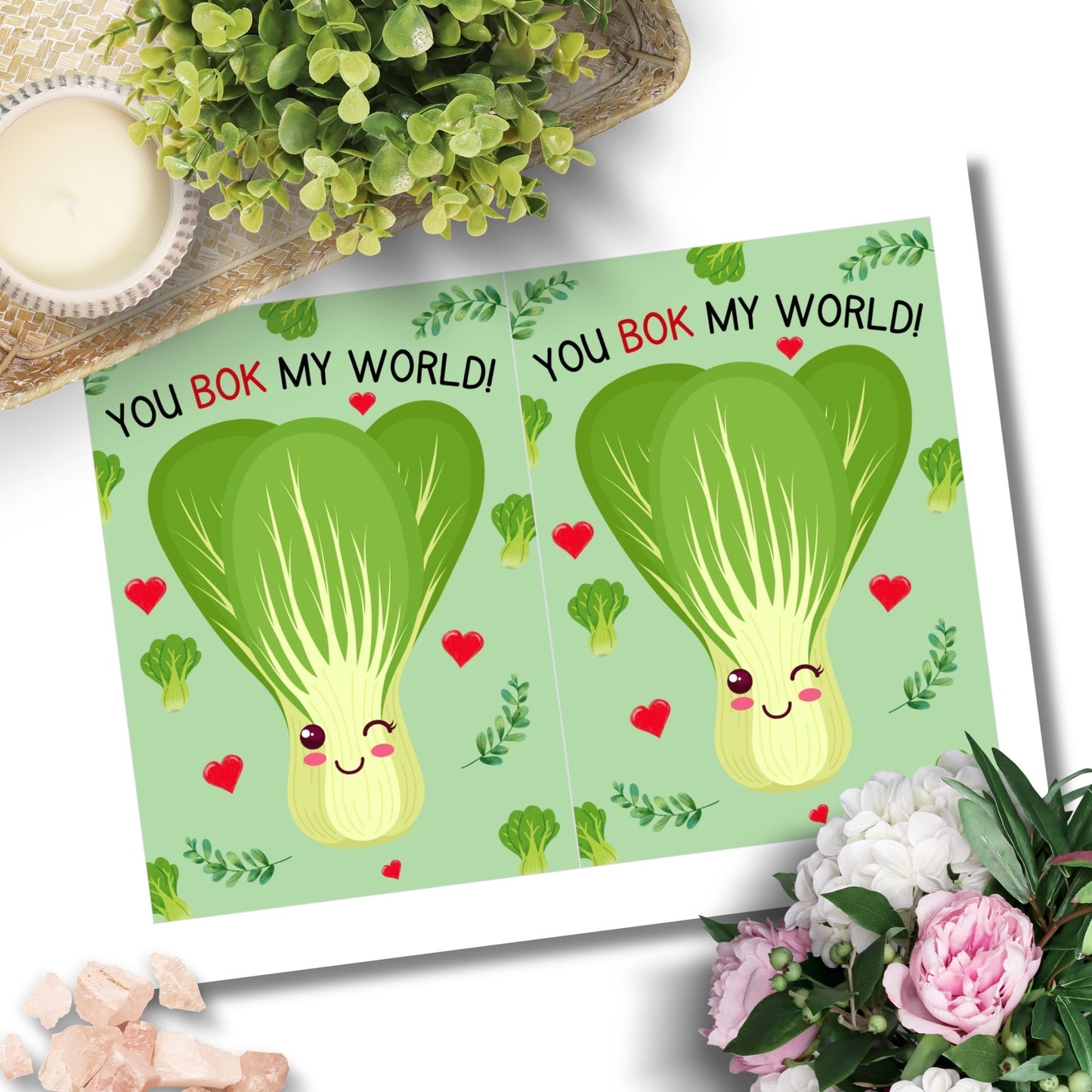 Printable Valentineās Day Greeting Card featuring the phrase āYou Bok My Worldā with a fun bok choy illustration. Designed as a 5x7 PDF on an 8.5 x 11 sheet with two cards per page. A cute and punny Valentineās card for veggie lovers and friends.