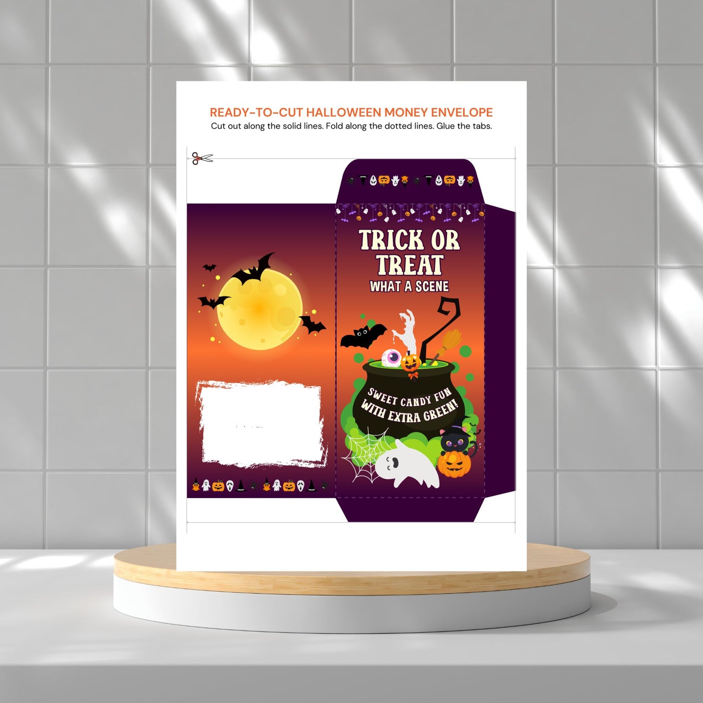 Halloween-themed money envelope on a white platform with a gray tiled wall background