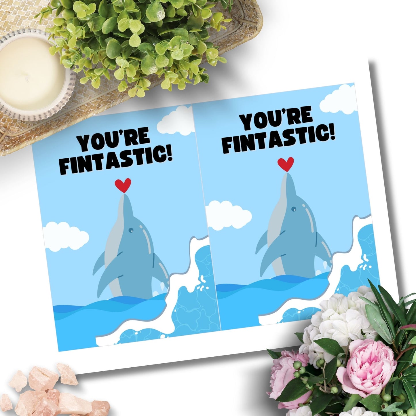 Printable Valentine’s Day Greeting Card featuring the phrase “You’re Fintastic” with a dolphin theme. Designed as a 5x7 PDF on an 8.5 x 11 sheet with two cards per page. A cute and punny Valentine’s card for dolphin and ocean lovers.