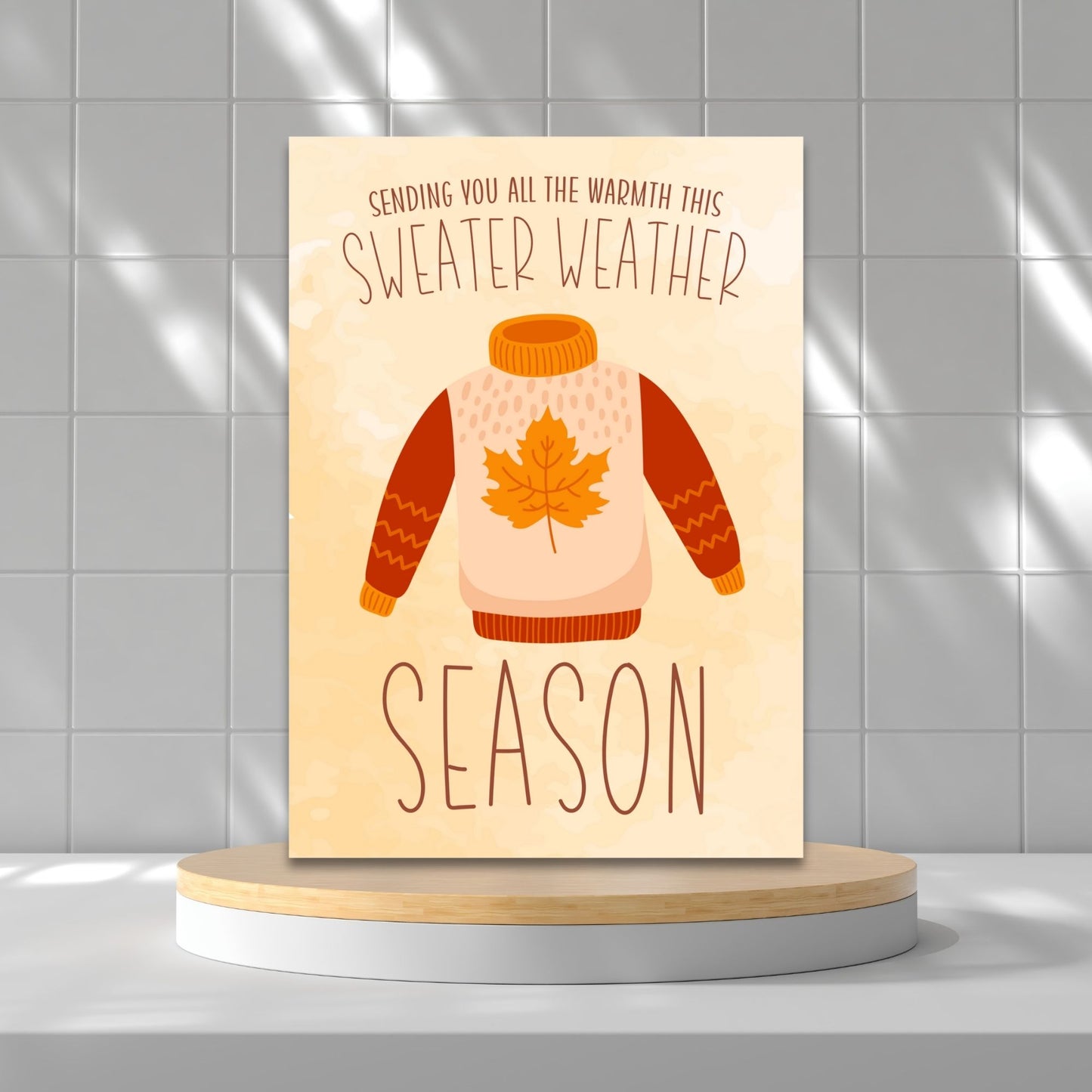 Printable Fall Greeting Card featuring a cozy sweater design with the message 'Sending You All the Warmth This Sweater Weather Season,' set on a warm autumn background.