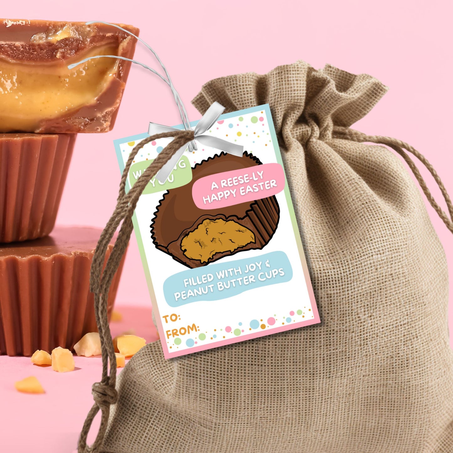 Colorful Easter-themed printable gift tags attached to peanut butter chocolate cups, featuring playful bunny illustrations and the cheerful message 'Wishing You a Hoppy Easter!