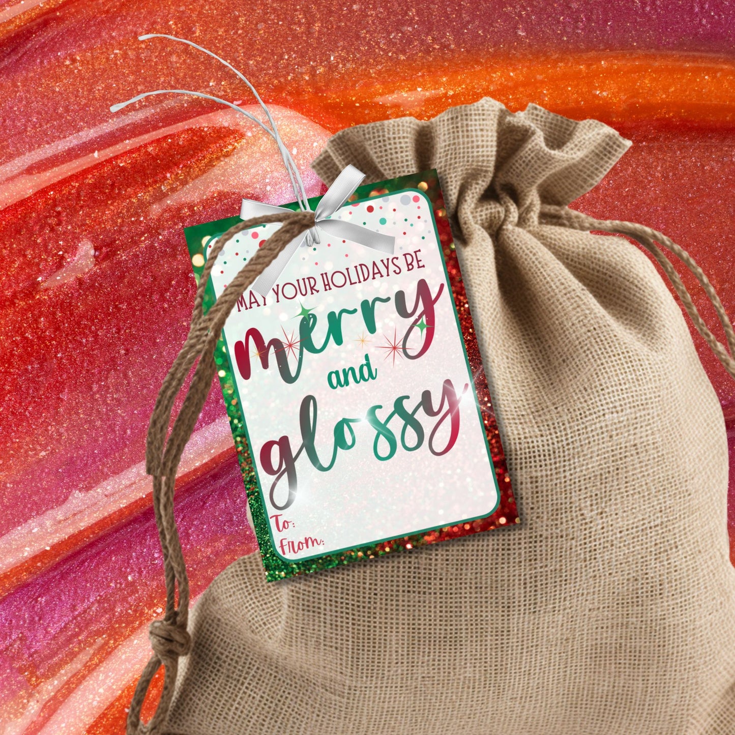 Christmas gift tags featuring the message "May Your Holidays Be Merry and Glossy" with a sparkling, festive design. Perfect for gifts like lip gloss, nail polish, or any glossy present, these printable and editable tags add a polished holiday touch.