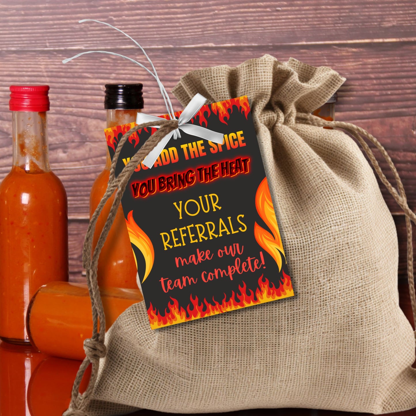 A printable PDF of hot sauce-themed referral gift tags, titled "You Add the Spice, You Bring the Heat," customizable in Canva.
