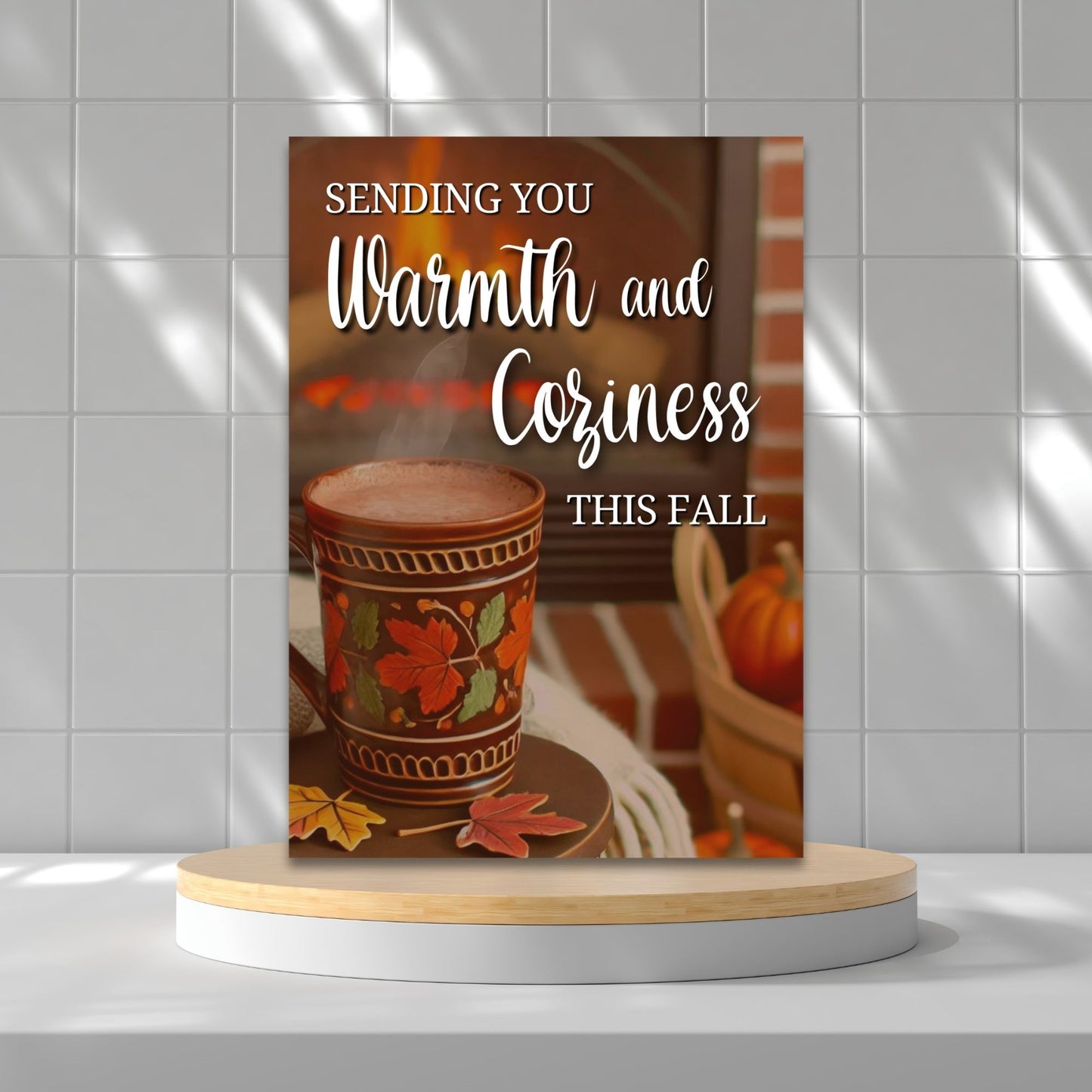 Printable Fall Greeting Card with a cozy scene featuring a steaming mug and fireplace, and the message 'Sending You Warmth and Coziness This Fall,' ideal for autumn greetings.