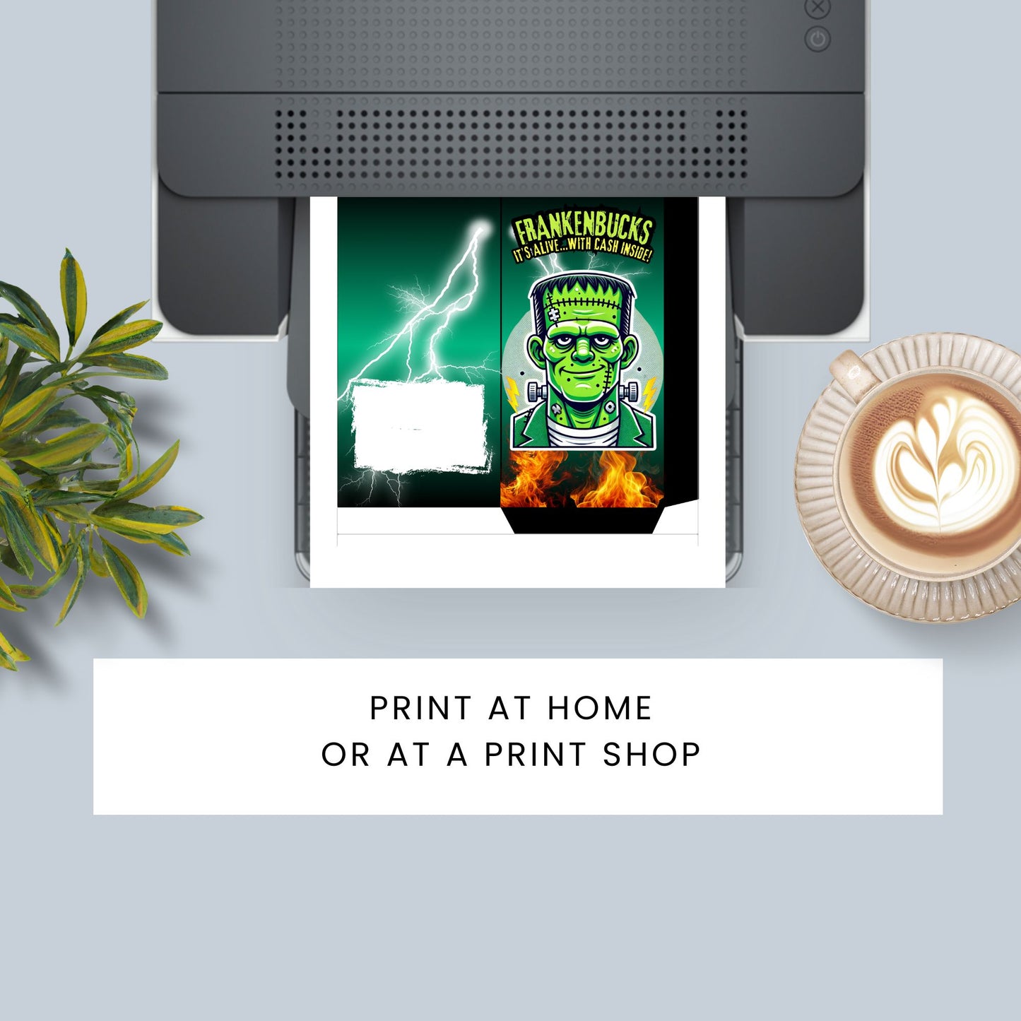 Printer with a printed design of a green monster character on a white surface with a plant and coffee cup.