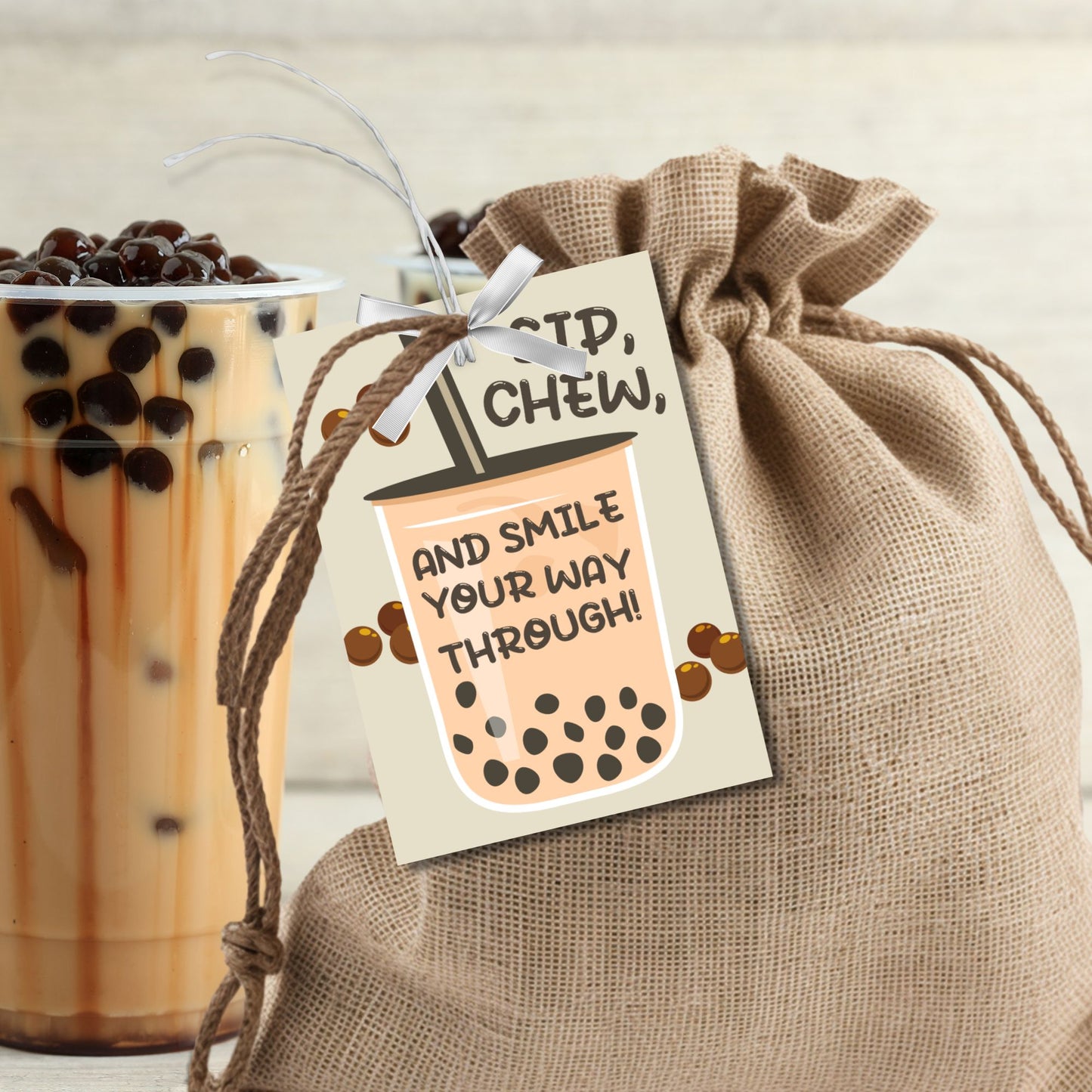 A cute and bubbly gift tag featuring a boba tea cup with the message: "Sip, Chew, and Smile Your Way Through!" Perfect for boba-themed gifts.