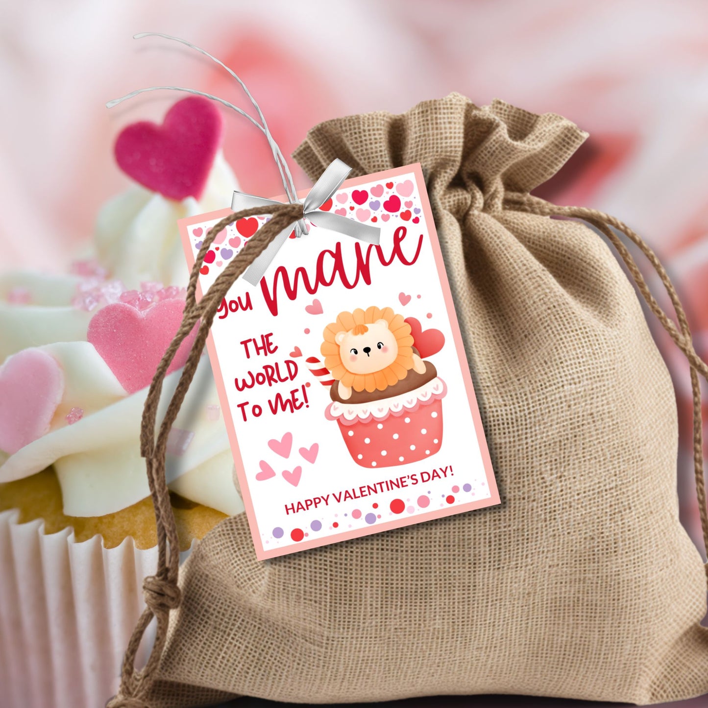 Printable and editable lion-themed Valentineās Day gift tags featuring a cute lion sitting in a cupcake with the message "You MANE the World to Me!" Perfect for pairing with cupcakes, plush lions, and sweet treats.