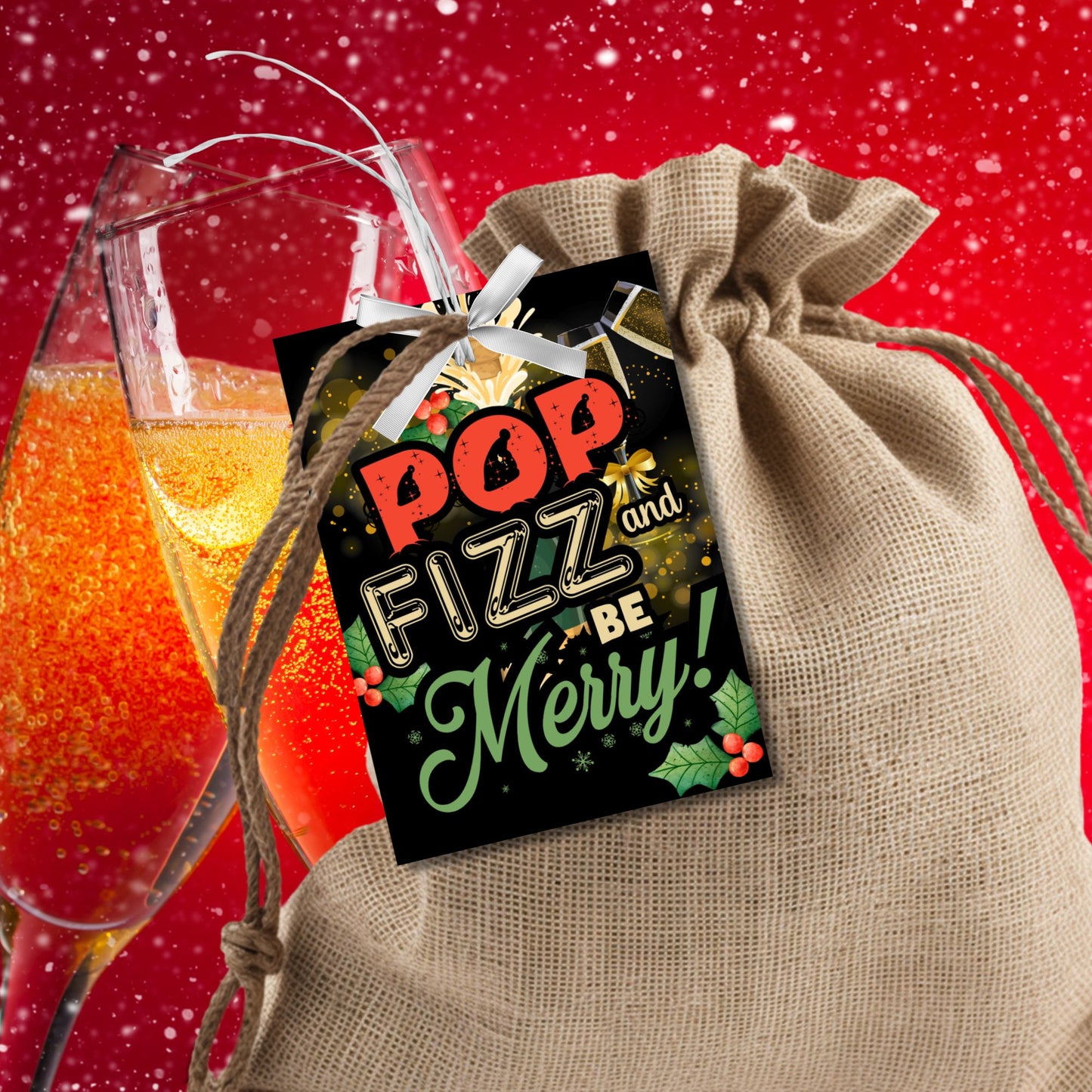 Christmas gift tags with the message "Pop, Fizz, and Be Merry!" featuring champagne glasses, holly, and a festive design, perfect for adding to champagne or sparkling wine gifts. These printable and editable tags are ideal for holiday celebrations.