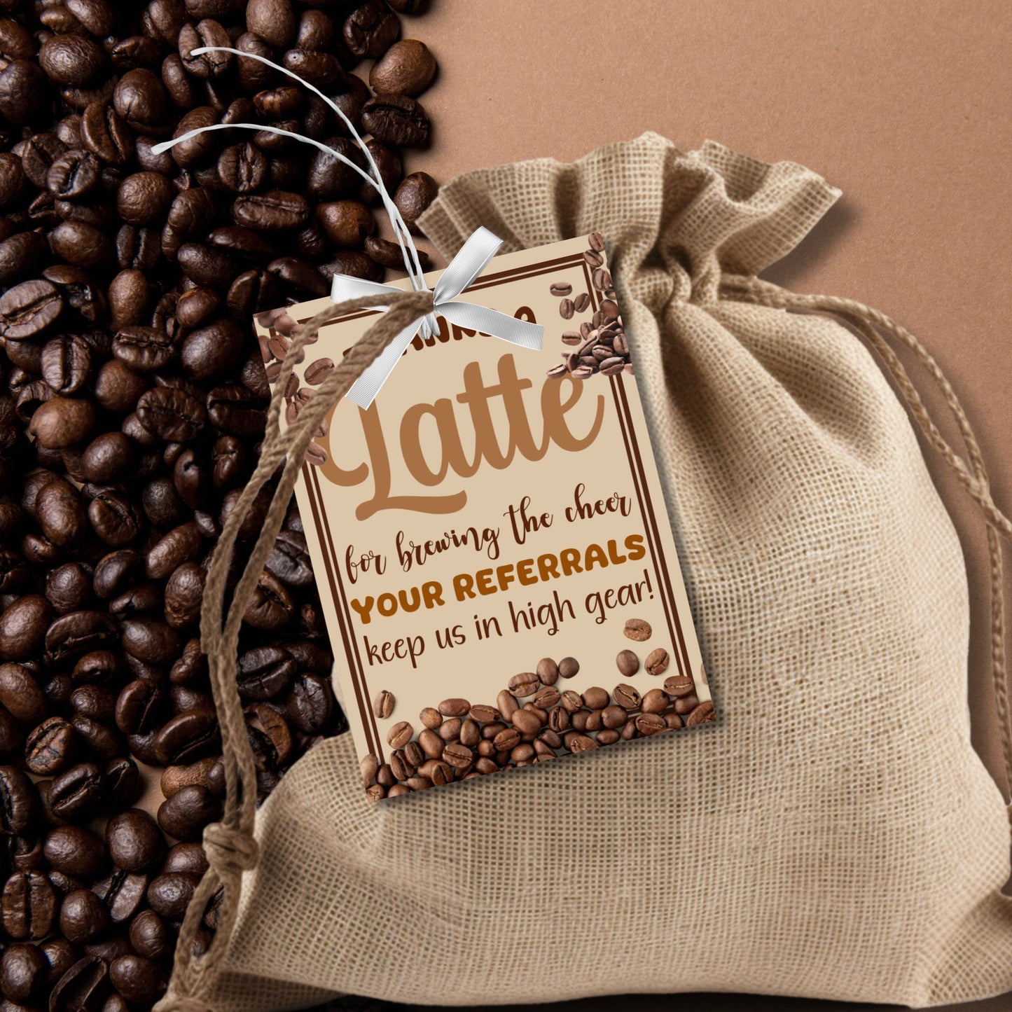 A printable PDF of coffee-themed referral gift tags titled "Thanks a Latte for Brewing the Cheer," customizable through Canva.