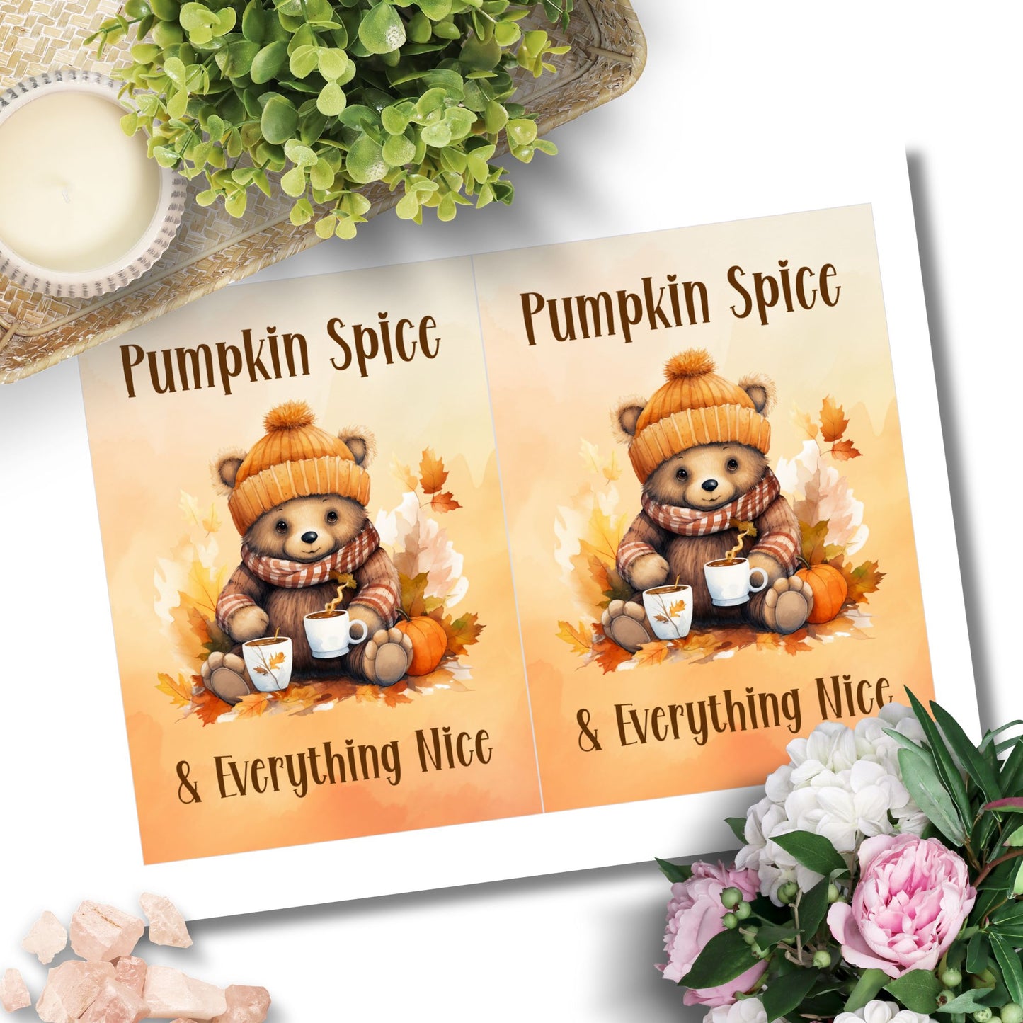 Two identical cards with a bear wearing a pumpkin spice hat and scarf, holding a cup, surrounded by pumpkins and leaves, with text 'Pumpkin Spice & Everything Nice'.