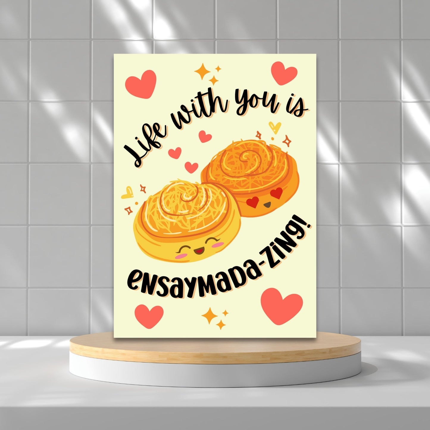 Printable Valentineās Day card featuring the phrase āLife with You is Ensaymadazingā with a Filipino ensaymada-inspired design. Designed as a 5x7 PDF on an 8.5 x 11 sheet with two cards per page. A punny and heartfelt Valentineās card for Filipino food lovers.