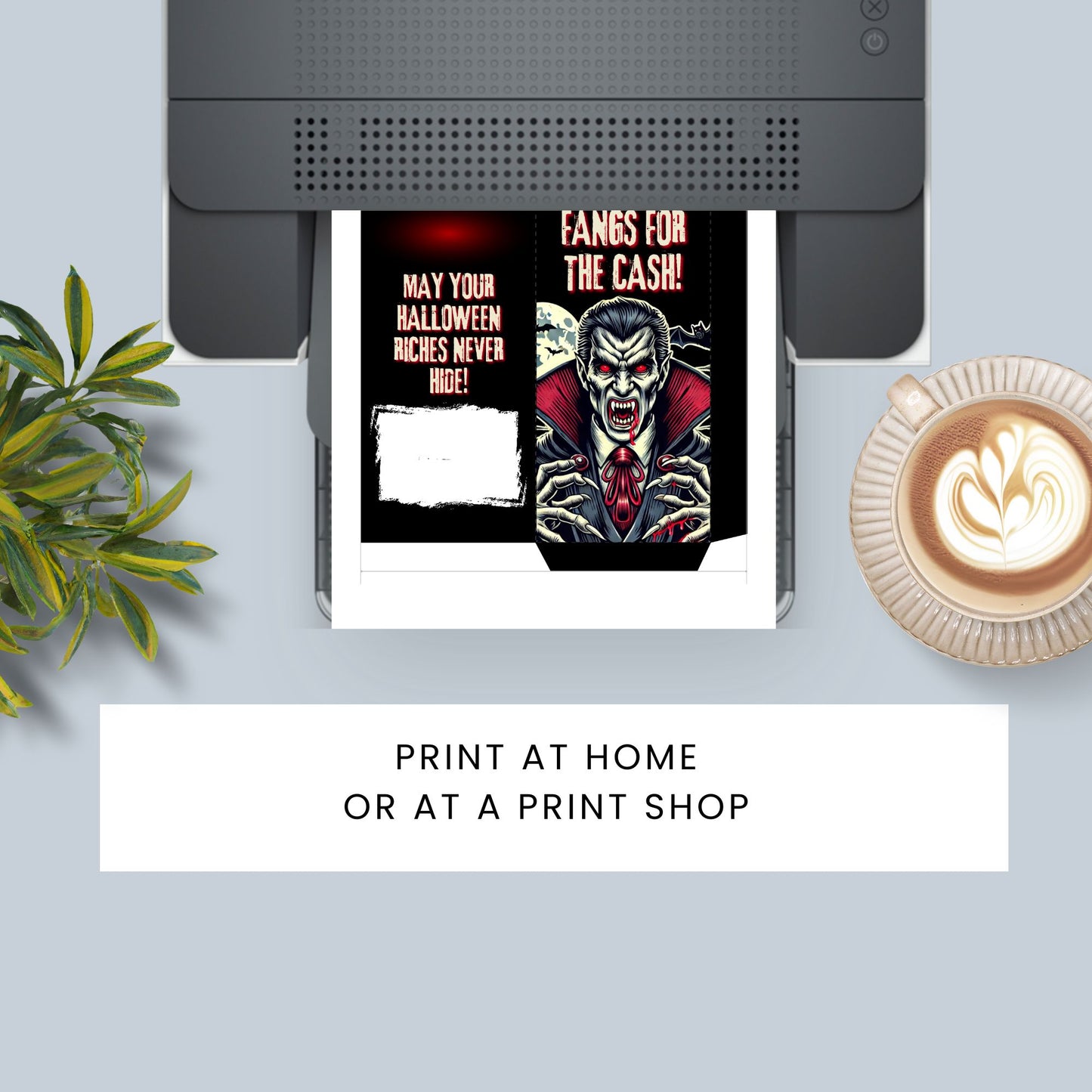 Printed flyer with vampire design and text on a desk with a plant and coffee.