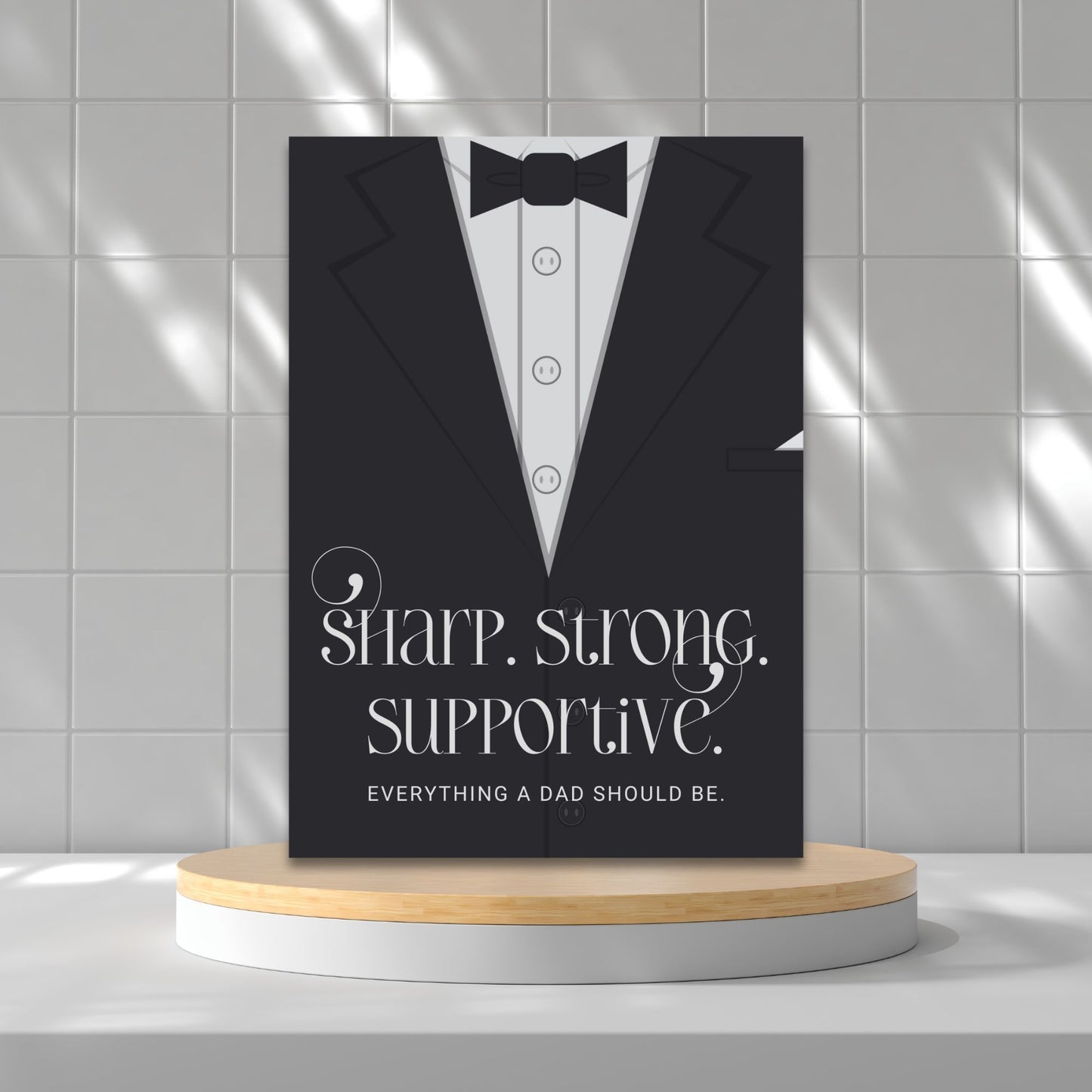 Father's Day card printable with bold text 'Sharp. Strong. Supportive.' featuring a minimalist design of a suit and tie in grayscale tones.
