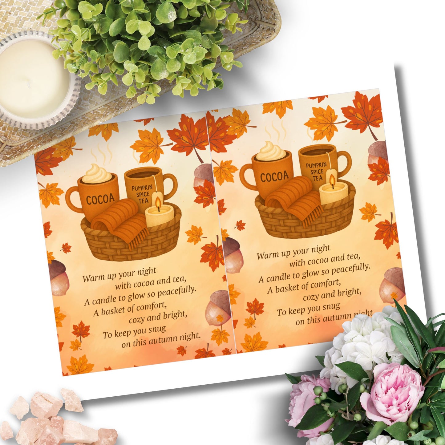 Autumn-themed placemat with mugs of cocoa, tea, and a candle, surrounded by flowers and a plant.