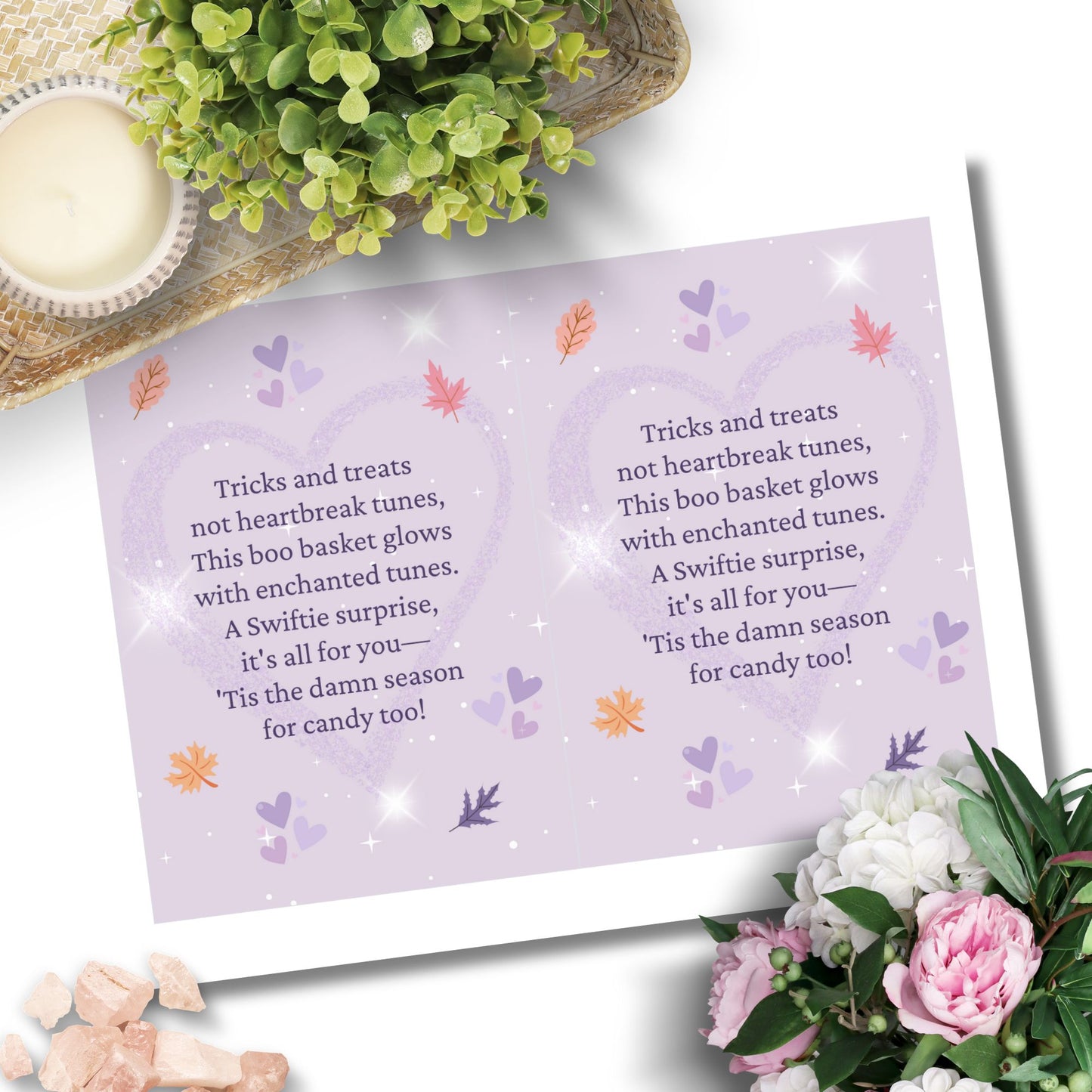 Halloween-themed card with text and decorative elements on a white background with flowers and a candle.