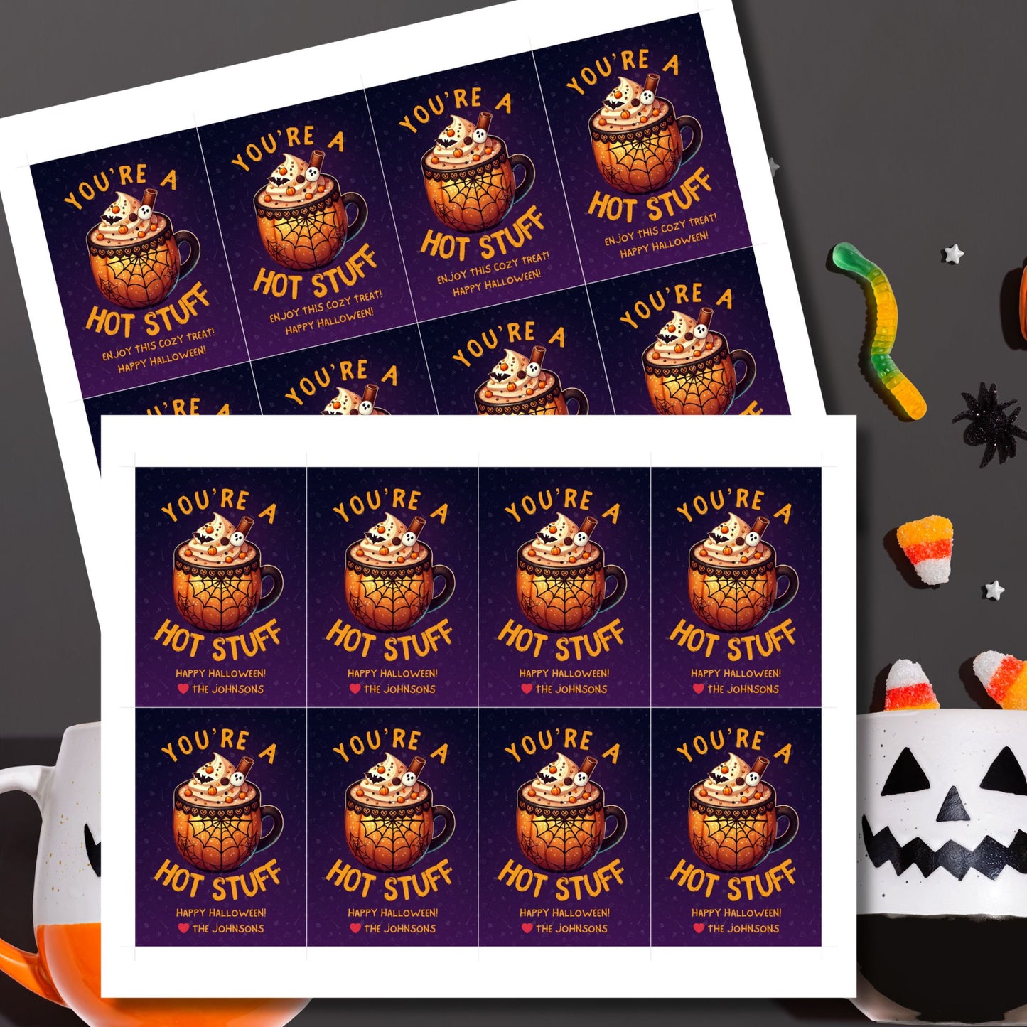 Halloween-themed printable gift tags with the message "You're a Hot Stuff" featuring a festive mug of hot cocoa on a dark purple background. Tags are 2.5 x 3.5 inches, laid out 8 per sheet on a standard 8.5 x 11-inch page. Includes a printable PDF and a PDF with a link to an editable Canva template.