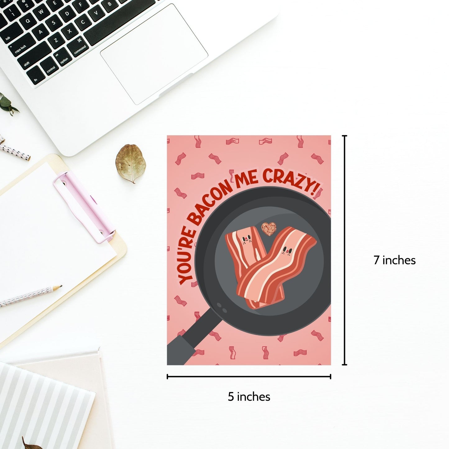 Printable Valentine’s Day Greeting Card featuring the phrase “You’re Bacon Me Crazy” with a bacon theme. Designed as a 5x7 PDF on an 8.5 x 11 sheet with two cards per page. A fun and punny Valentine’s card for bacon lovers and friends.