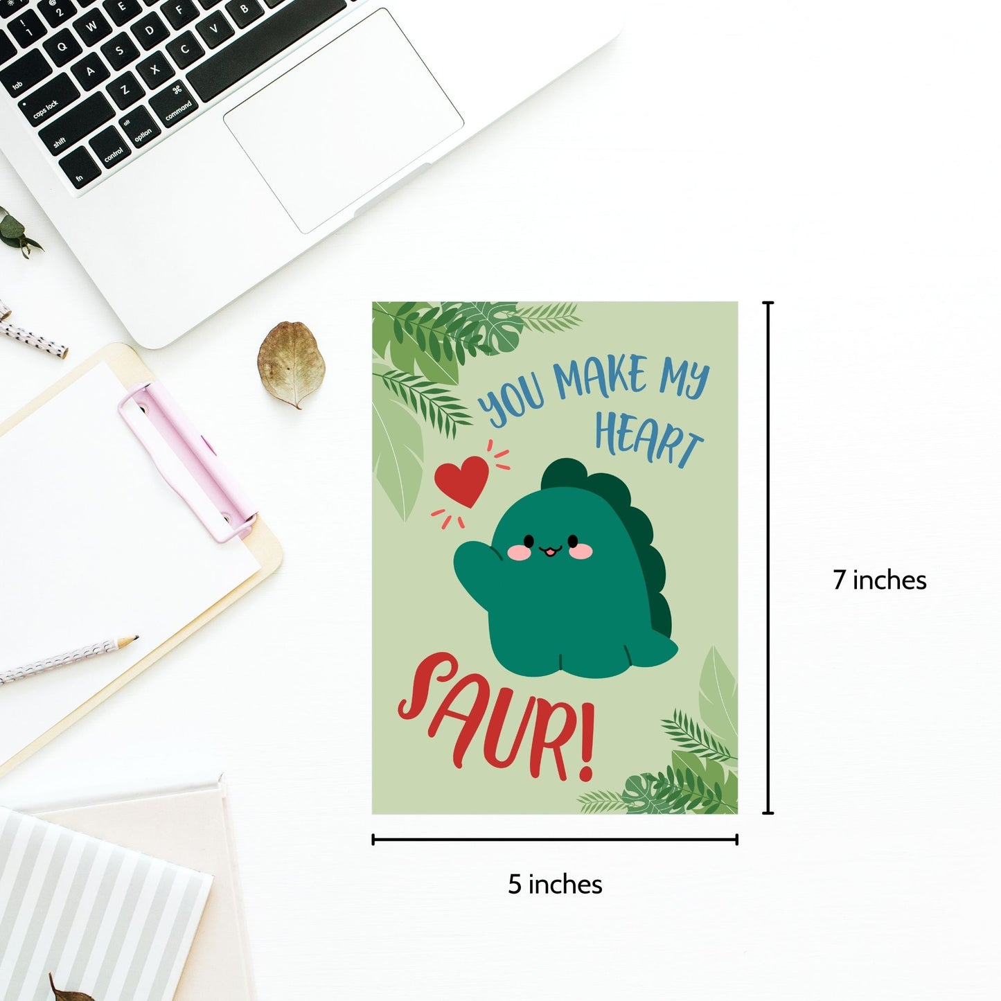 Printable Valentineās Day Greeting Card featuring the pun āYou Make My Heart Saur.ā Designed as a 5x7 PDF on an 8.5 x 11 sheet with two cards per page. A fun and adorable Valentineās card for dinosaur lovers!