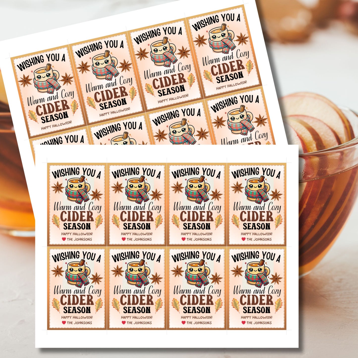 A printable Halloween gift tag featuring a warm and cozy cider theme. The tag displays a cute mug wrapped in a scarf, surrounded by autumn leaves and star anise, with the message "Wishing You a Warm and Cozy Cider Season."