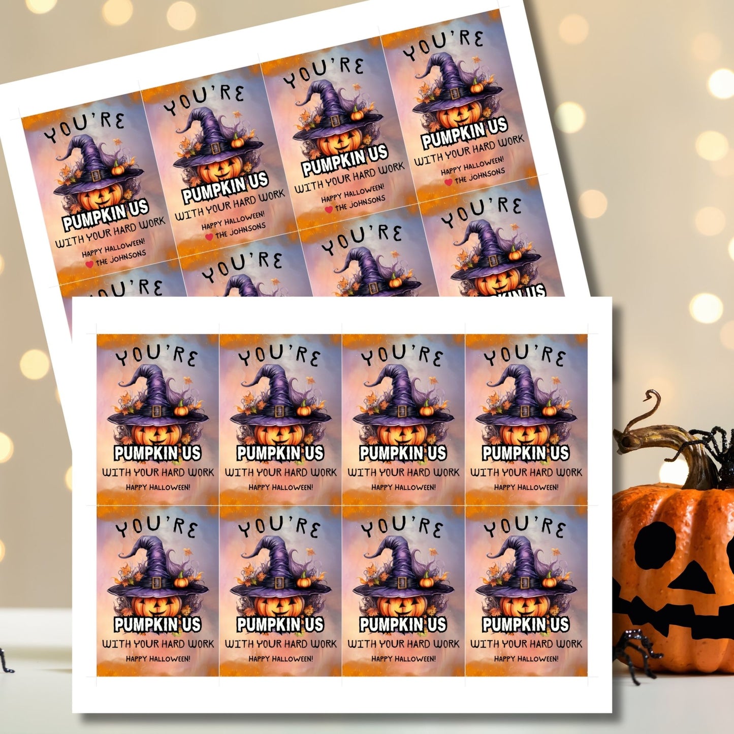 Halloween-themed printable gift tags with the message "You're Pumpkin Us With Your Hard Work" featuring a festive pumpkin in a witch's hat on a Halloween background. Tags are 2.5 x 3.5 inches, laid out 8 per sheet on a standard 8.5 x 11-inch page. Includes a printable PDF and a PDF with a link to an editable Canva template.